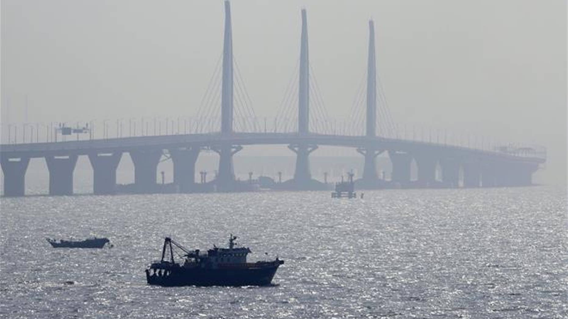 A boat sails near the Hong Kong-Zhuhai-Macau Bridge, in Zhuhai city in China on March 28, 2018.