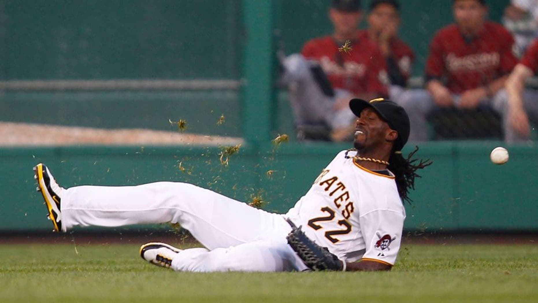 PITTSBURGH - JULY 06: Andrew McCutchen #22 of the Pittsburgh Pirates misplays a ball in center field hit by Carlos Lee #45 of the Houston Astros during the game on July 6, 2011 at PNC Park in Pittsburgh, Pennsylvania. The Pirates were charged an error and Lee ended up with a stand up triple. (Photo by Jared Wickerham/Getty Images)