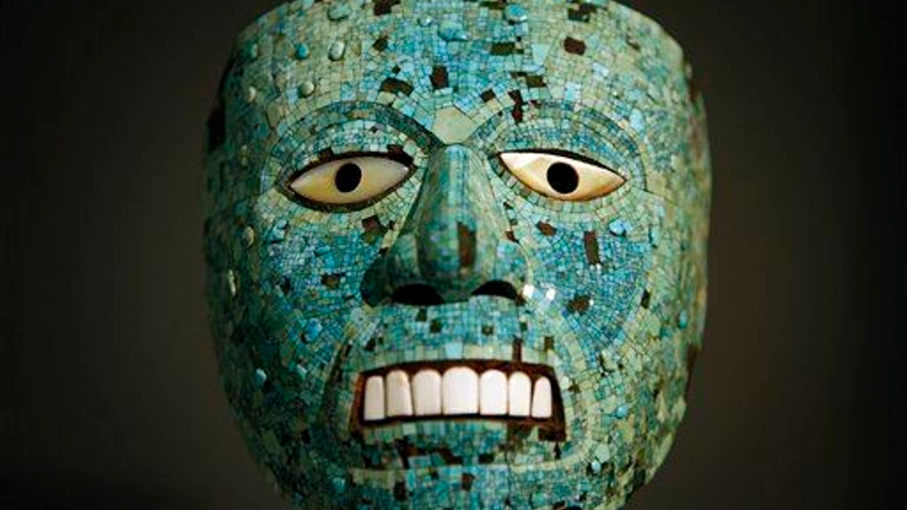 File photo of a turquoise mask, probably representing the sun god Tonatiuh, at a museum exhibit on the Aztecs.
