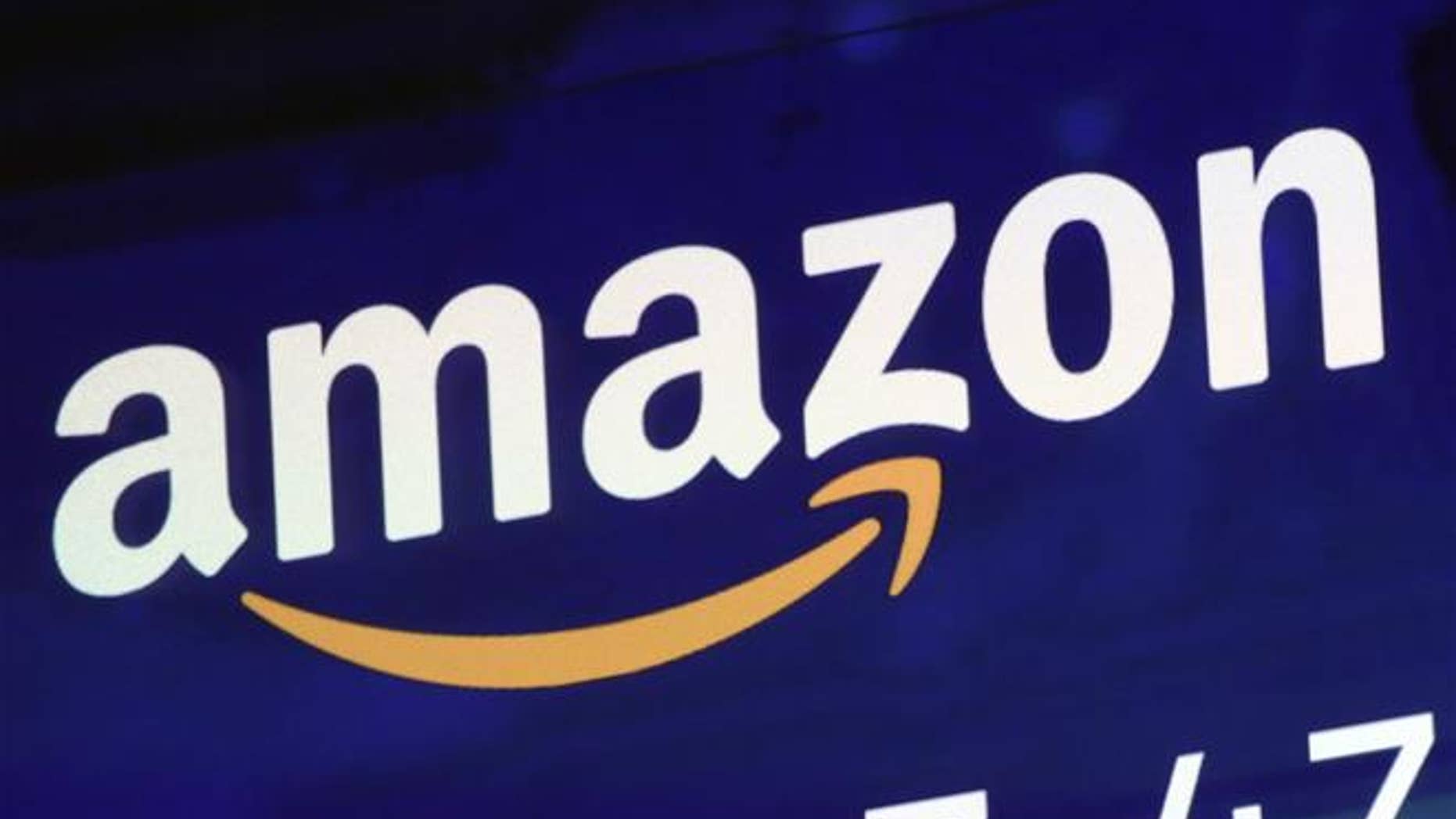 The logo for Amazon is displayed on a screen at the Nasdaq MarketSite, Friday, July 27, 2018.