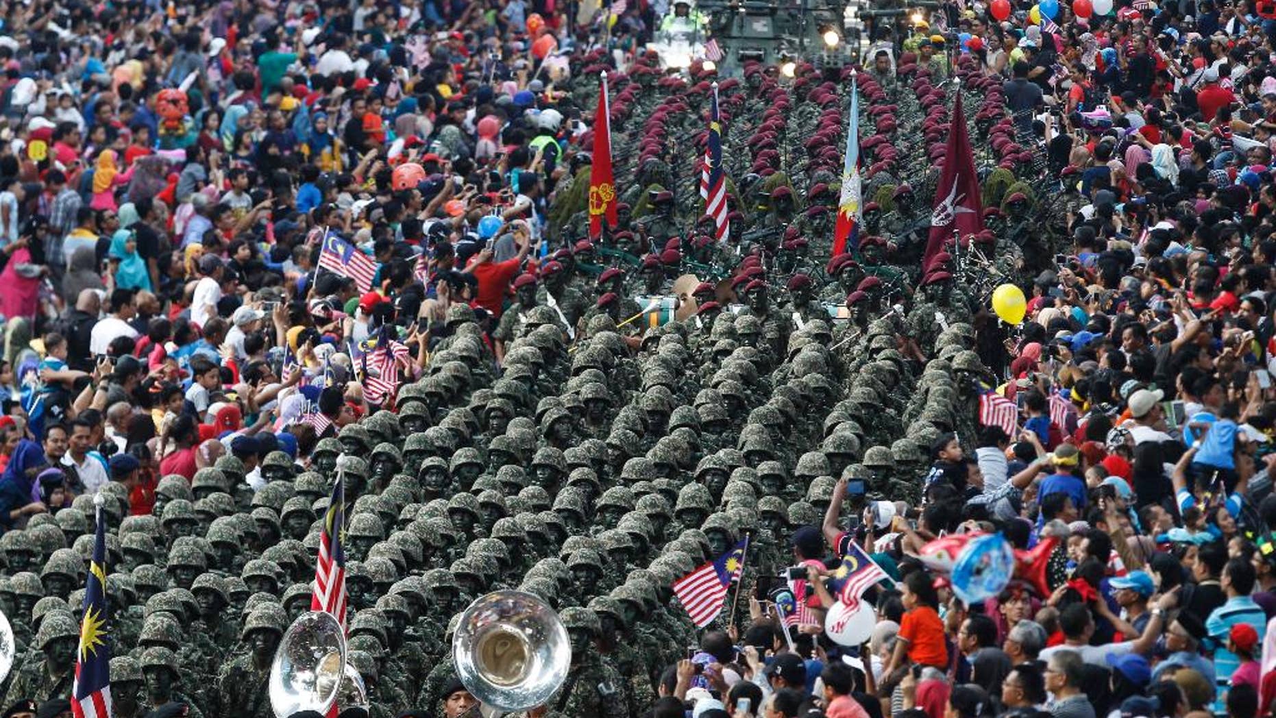 Malaysian Army personnel marching at the Independence Square in Kuala Lumpur Wednesday.