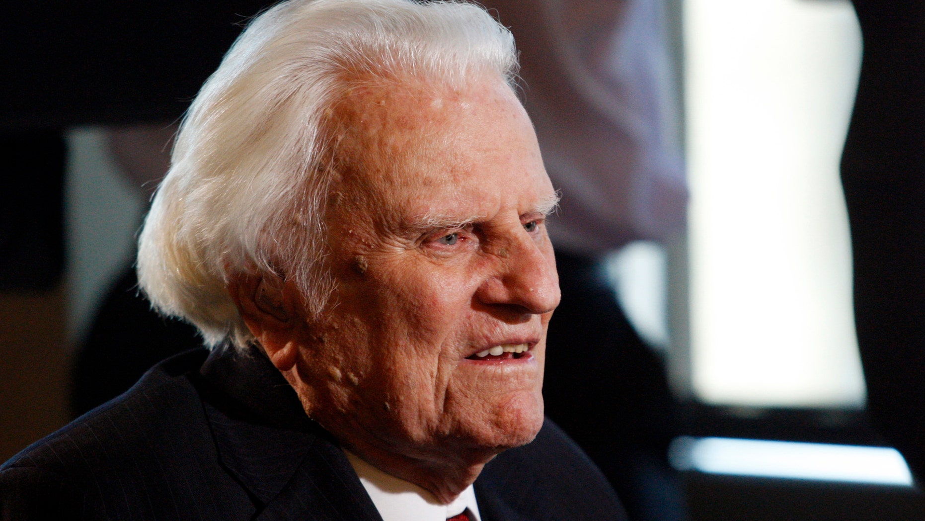 FILE - In this Dec. 20, 2010 file photo, evangelist Billy Graham, 92, speaks during an interview at the Billy Graham Evangelistic Association headquarters in Charlotte, N.C. Graham, who transformed American religious life through his preaching and activism, becoming a counselor to presidents and the most widely heard Christian evangelist in history, has died. Spokesman Mark DeMoss says Graham, who long suffered from cancer, pneumonia and other ailments, died at his home in North Carolina on Wednesday, Feb. 21, 2018. He was 99. (AP Photo/Nell Redmond, File)