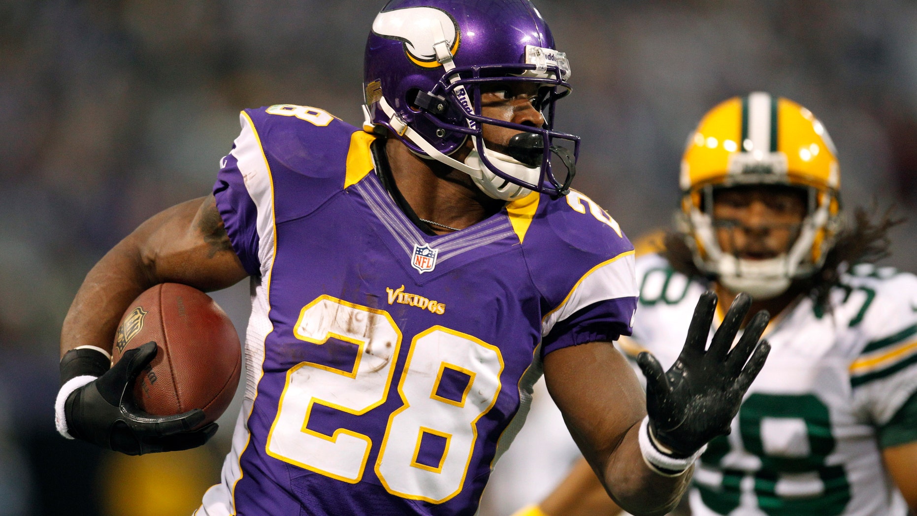 Dec. 30, 2012: Minnesota Vikings running back Adrian Peterson, left, runs from Green Bay Packers cornerback Tramon Williams during the first half of an NFL football game in Minneapolis.
