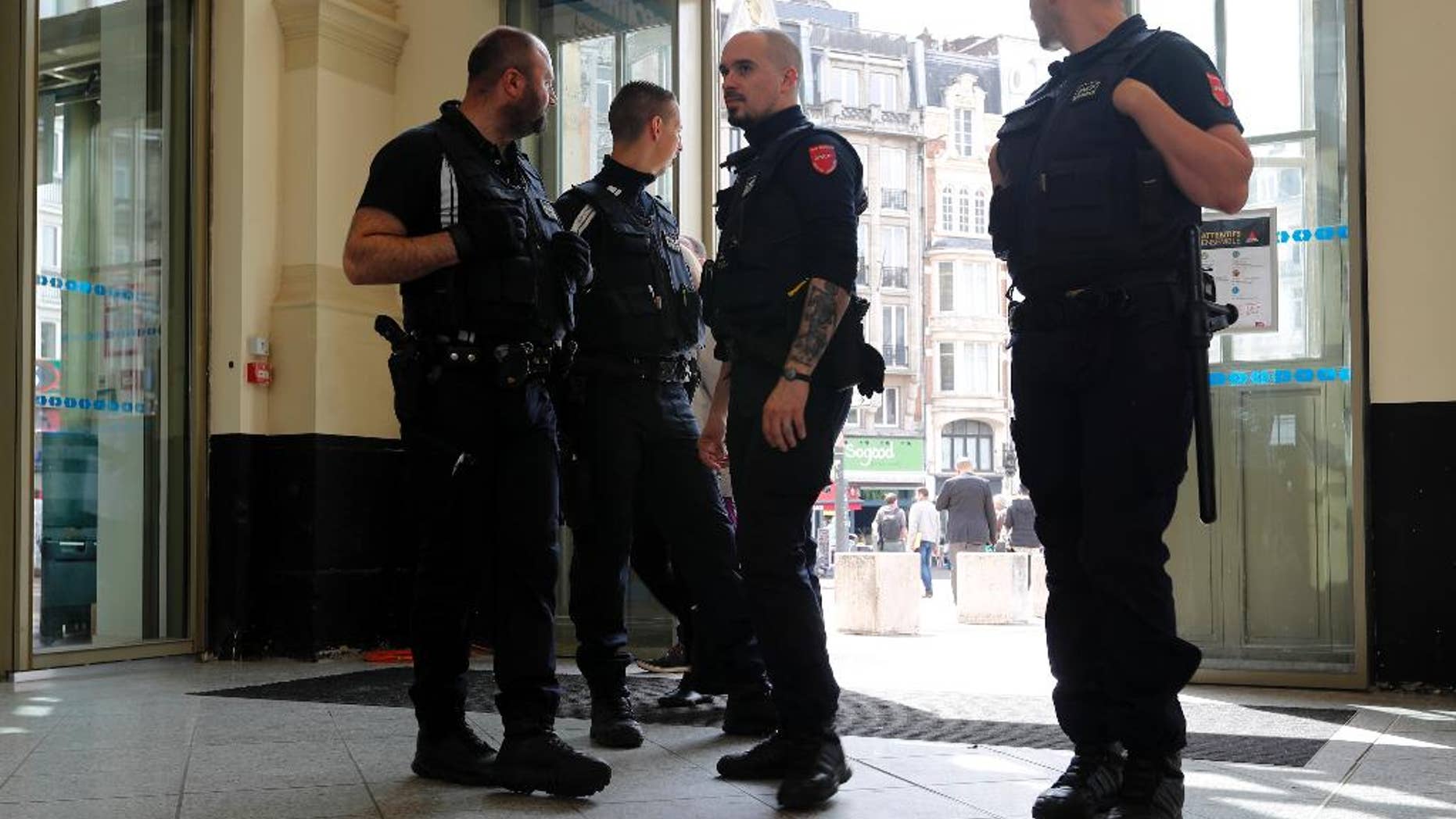 French police patrol the railway station in Lille, France, Tuesday, June 14, 2016, where Russia will play the Euro 2016 match against Slovakia. Russia coach Leonid Slutsky expects his team's fans to behave themselves in Wednesday's game against Slovakia and avoid his side being expelled from the European Championship. (AP Photo/Darko Bandic)