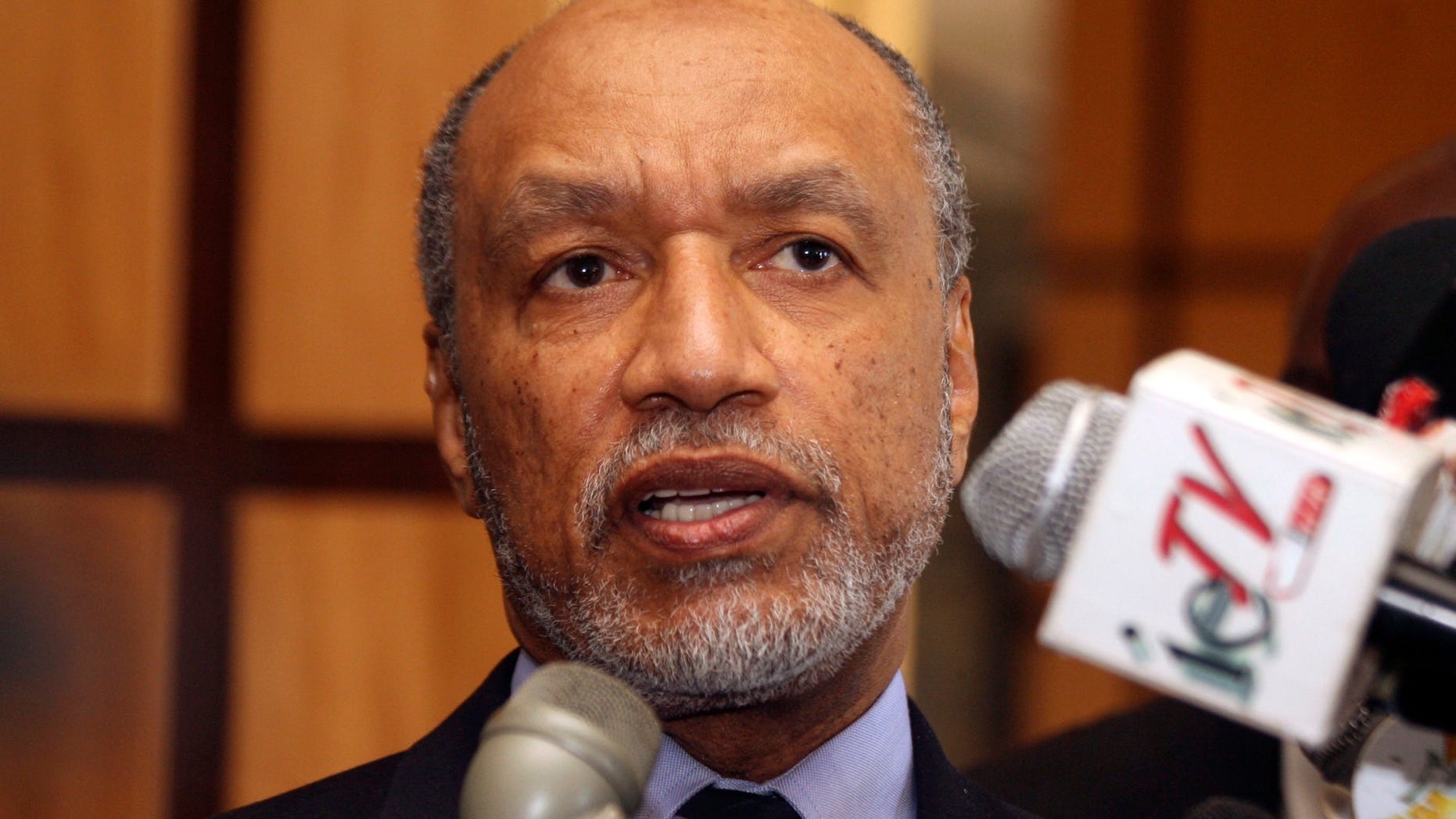 FILE - In this May 10, 2011 file picture Mohamed bin Hammam, chief of the Asian Football Confederation, talks to local media in Port of Spain, Trinidad & Tobago. Former FIFA presidential candidate Mohamed bin Hammam resigned from all football-related positions and was banned for life by world football’s governing body following “repeated violations” of its code of ethics while head of the Asian Football Confederation, it has been reported Monday, Dec. 17, 2012. Bin Hammam, who is an executive committee member, sent a resignation letter to both FIFA and the AFC on Dec. 15. The 63-year-old Qatari has also been fighting a life ban imposed by FIFA following allegations that he offered bribes to voters when running against incumbent Sepp Blatter in the presidential election. (AP Photo/Shirley Bahadur, File)