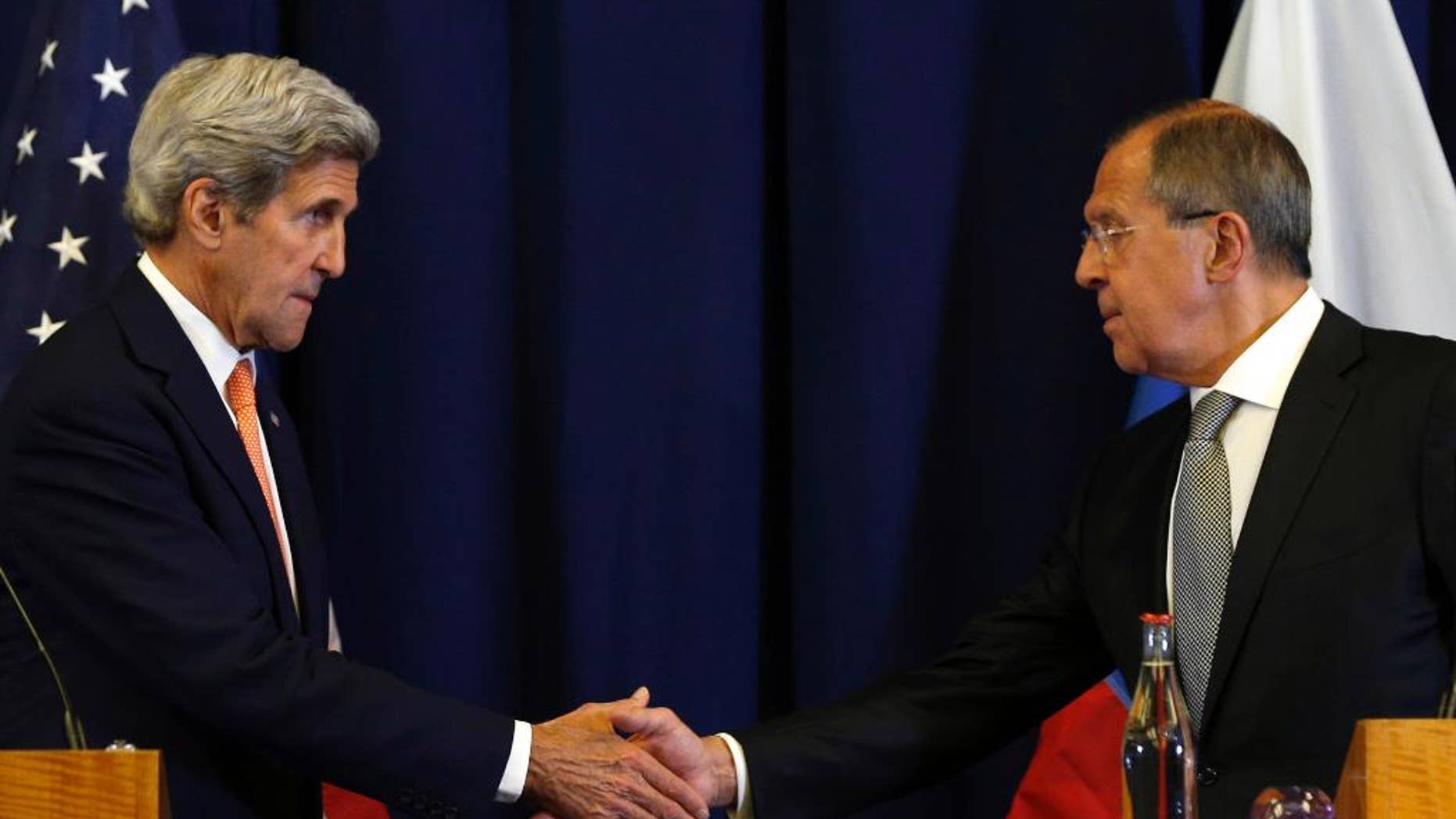In this Sept. 9, 2016, photo, U.S. Secretary of State John Kerry, left, and Russian Foreign Minister Sergei Lavrov shakes hands at the conclusion of a news conference following their meeting to discuss the crisis in Syria, in Geneva, Switzerland. The deal crafted by the U.S. and Russia to halt the Syrian civil war and focus efforts on rooting out extremists in the country is rife with legal and liability questions that are fueling Pentagon skepticism about military cooperation between the two powers, senior U.S. officials said. (Kevin Lamarque/Pool Photo via AP)