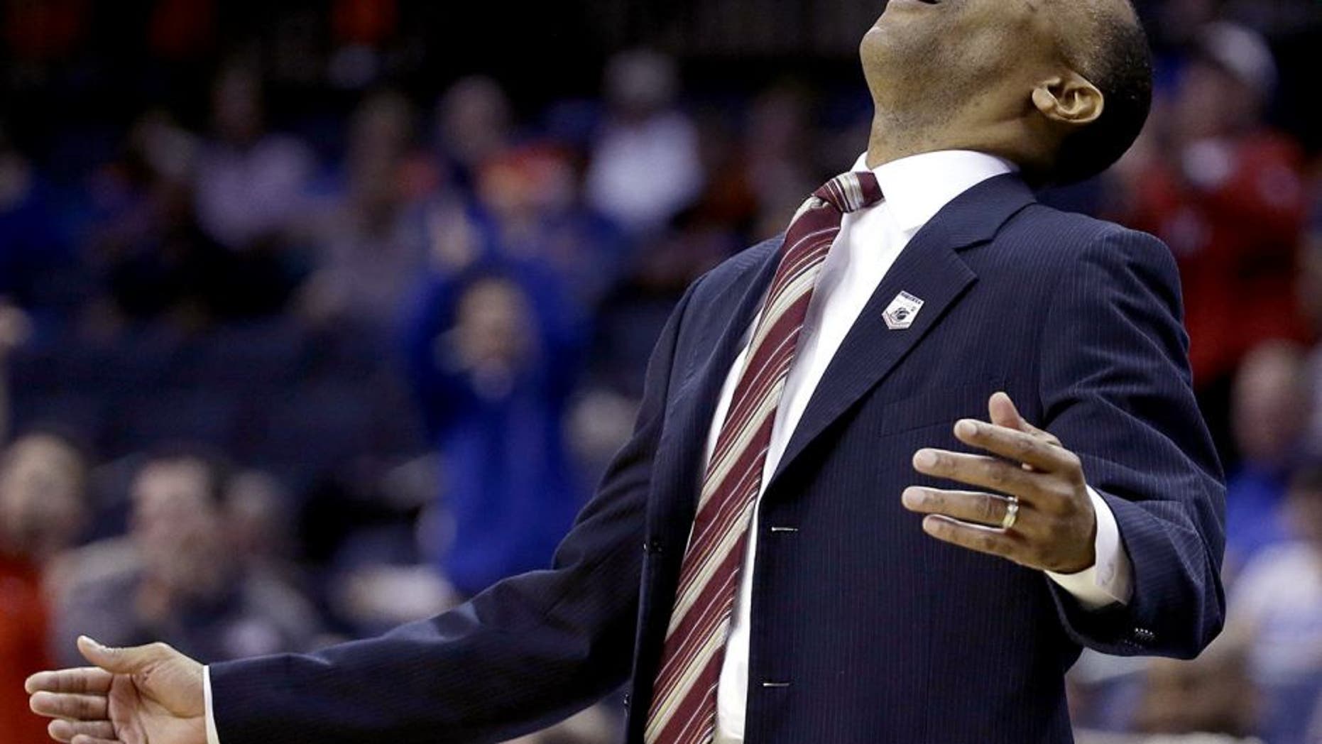 Stanford head coach Johnny Dawkins reacts to play against Dayton during the first half in a regional semifinal game at the NCAA college basketball tournament, Thursday, March 27, 2014, in Memphis, Tenn. (AP Photo/Mark Humphrey)