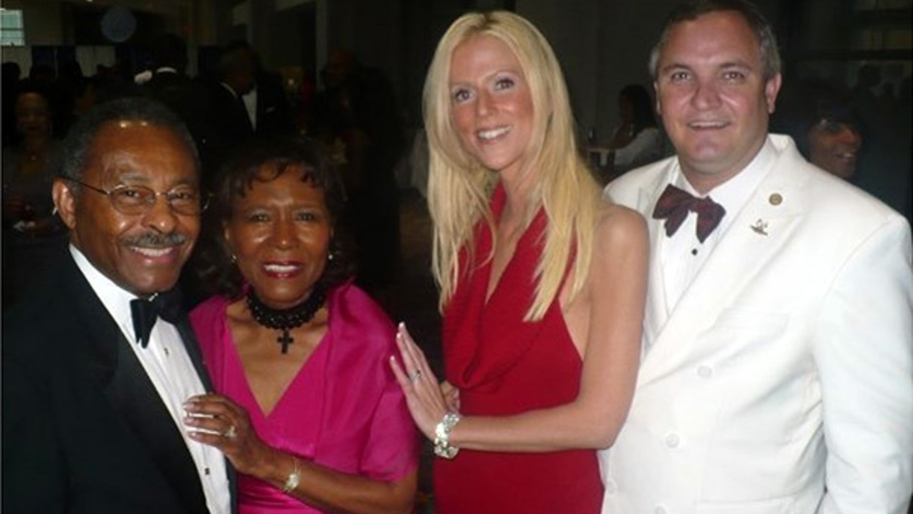 Sept. 26: Michaele and Tareq Salahi, right, with Sen. Roland Burris, D-Ill., left, and his wife Berlean at the Congressional Black Caucus Foundation's Awards Dinner in Washington. (AP)