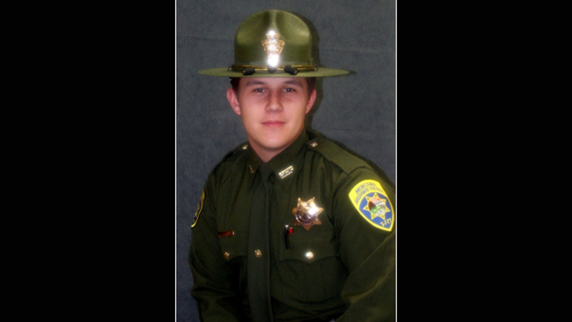 In this undated photo released by the Montana Highway Patrol, officer David Delaittre is shown.