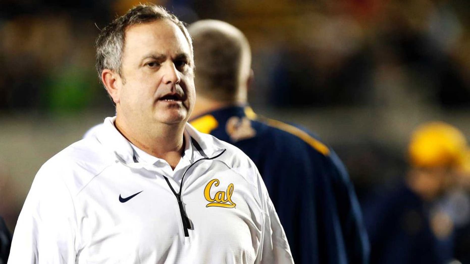 Nov 29, 2014; Berkeley, CA, USA; California Golden Bears head coach Sonny Dykes leaves the field after the loss against the Brigham Young Cougars at Memorial Stadium. The Brigham Young Cougars defeated the California Golden Bears 42-35. Mandatory Credit: Kelley L Cox-USA TODAY Sports