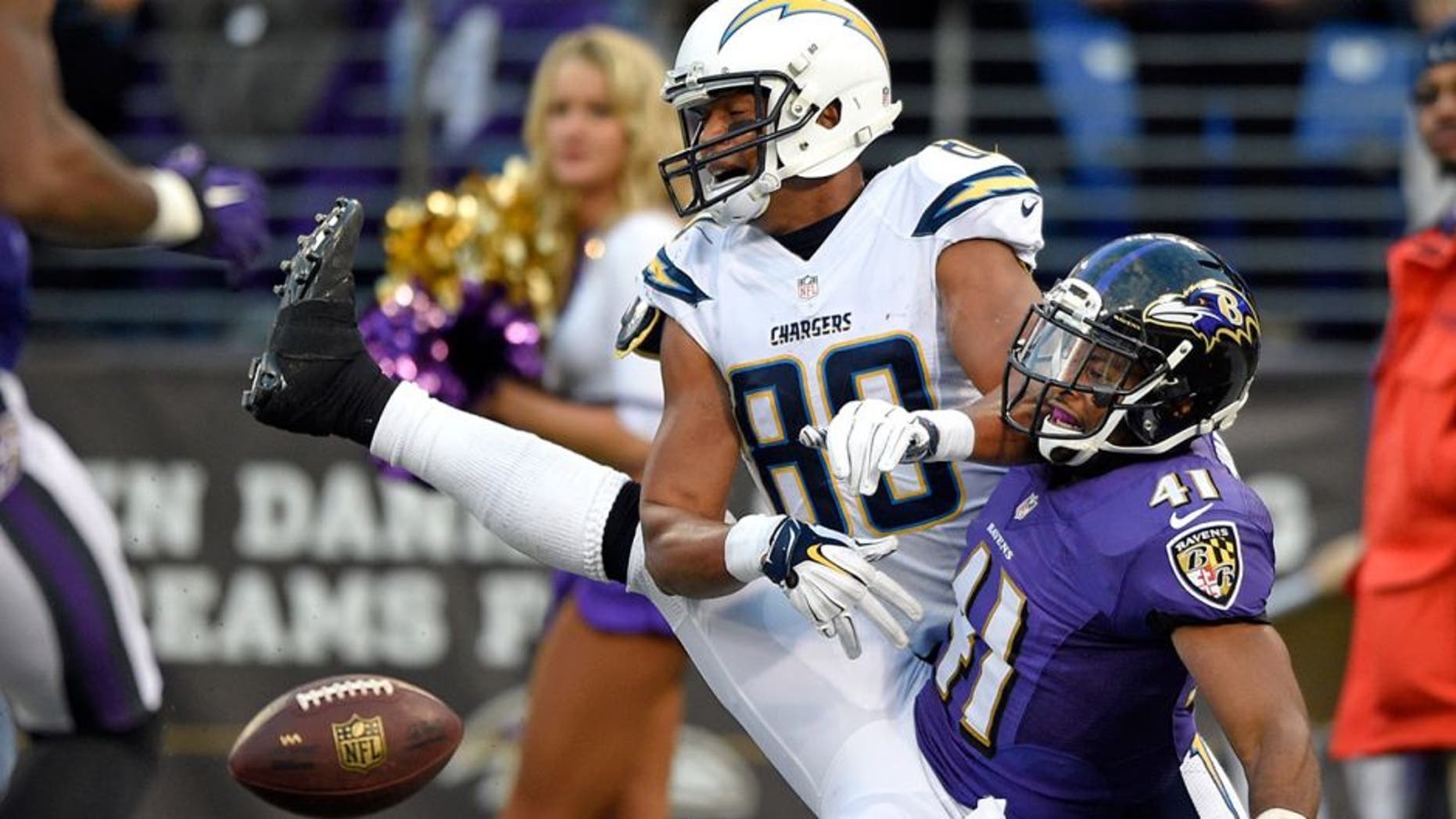 Baltimore Ravens cornerback Anthony Levine (41) breaks up a pass attempt to San Diego Chargers wide receiver Malcom Floyd in the end zone in the second half of an NFL football game, Sunday, Nov. 30, 2014, in Baltimore. Levine received a pass interference call on the play. San Diego won 34-33. (AP Photo/Nick Wass)
