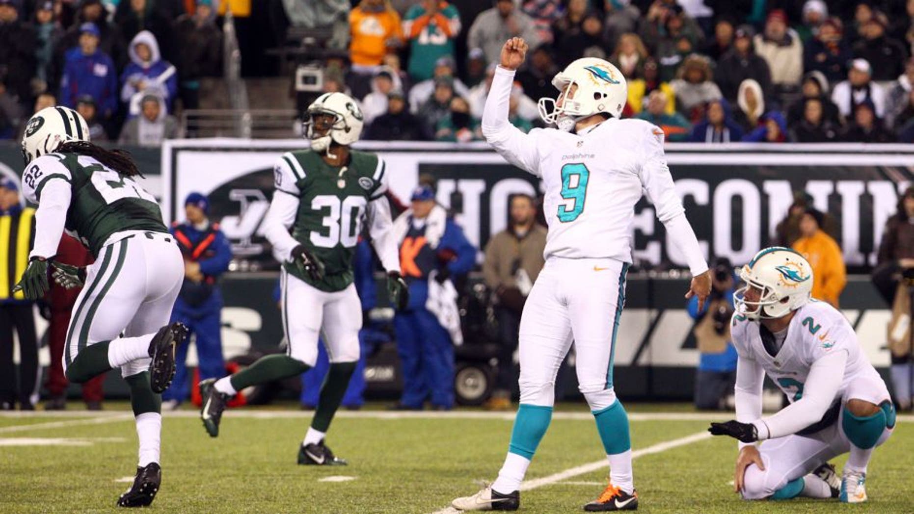 Dec 1, 2014; East Rutherford, NJ, USA; Miami Dolphins kicker Caleb Sturgis (9) kicks a field goal against the New York Jets during the fourth quarter of a game at MetLife Stadium. The Dolphins defeated the Jets 16-13. Mandatory Credit: Brad Penner-USA TODAY Sports