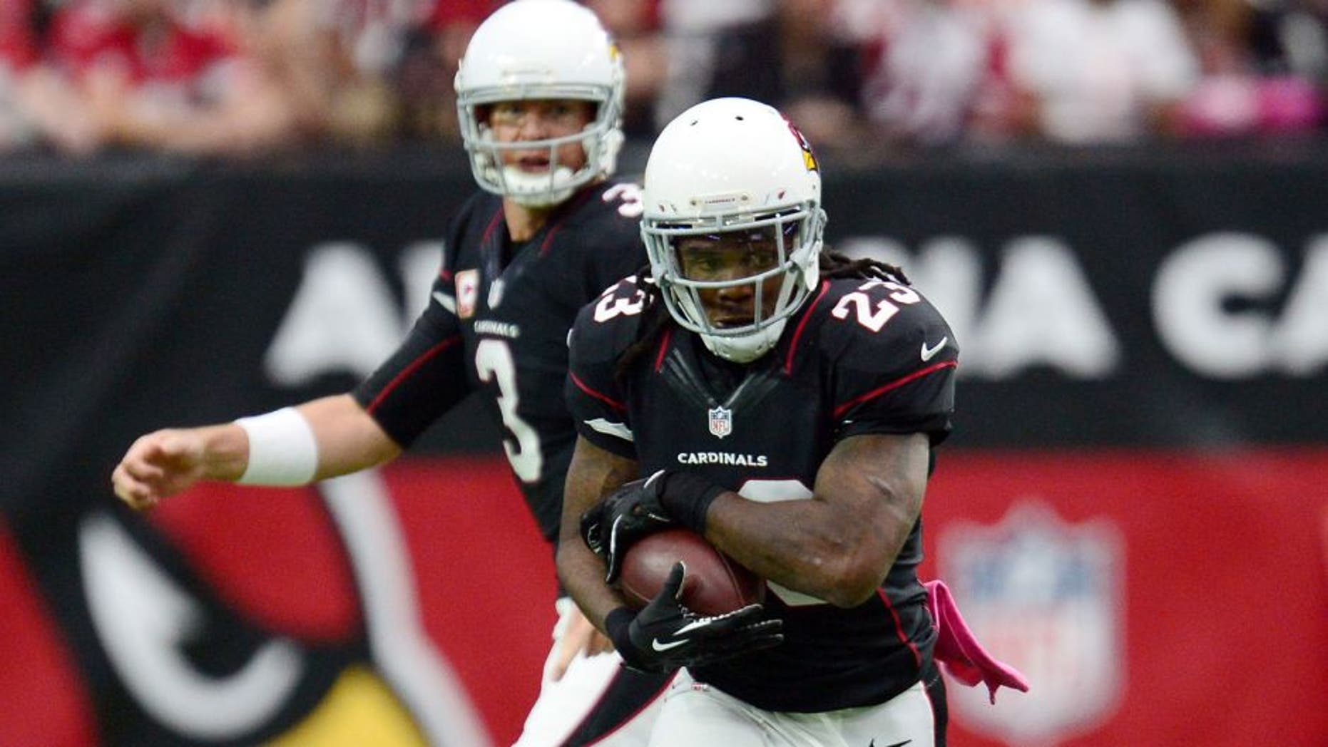 Oct 4, 2015; Glendale, AZ, USA; Arizona Cardinals running back Chris Johnson (23) runs the ball against the St. Louis Rams during the first half at University of Phoenix Stadium. The Rams won 24-22. Mandatory Credit: Joe Camporeale-USA TODAY Sports