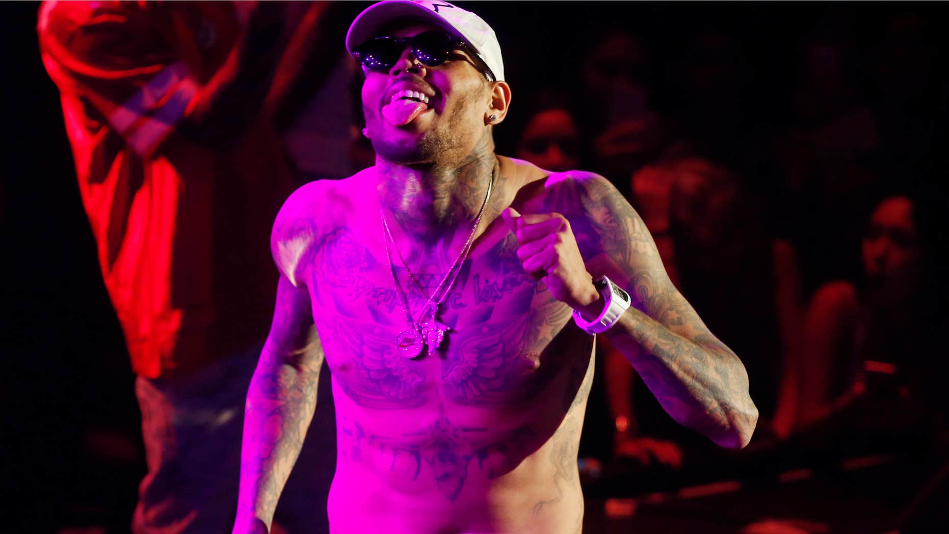 FILE - In this July 25, 2015 file photo, Grammy award-winning singer Chris Brown performs at a club in Macau.