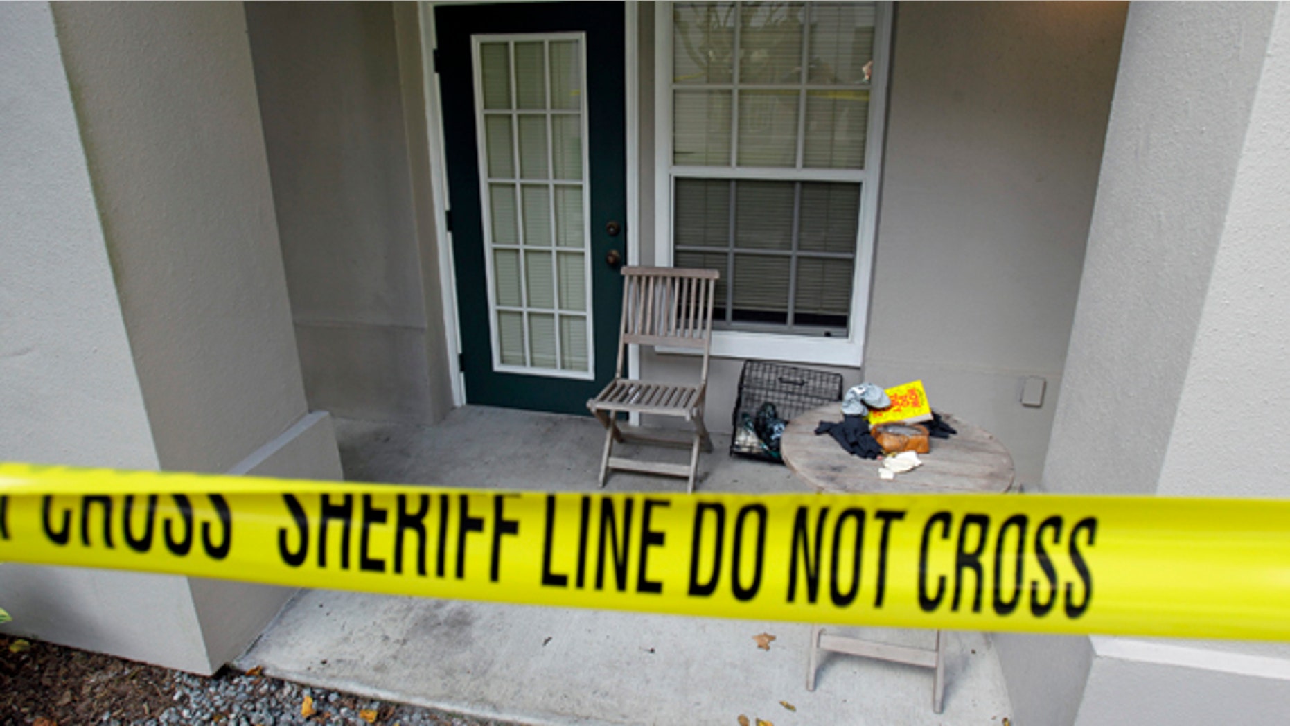 This photo taken Wednesday, Dec. 1, 2010, shows the crime scene at a condominium in Celebration, Fla.