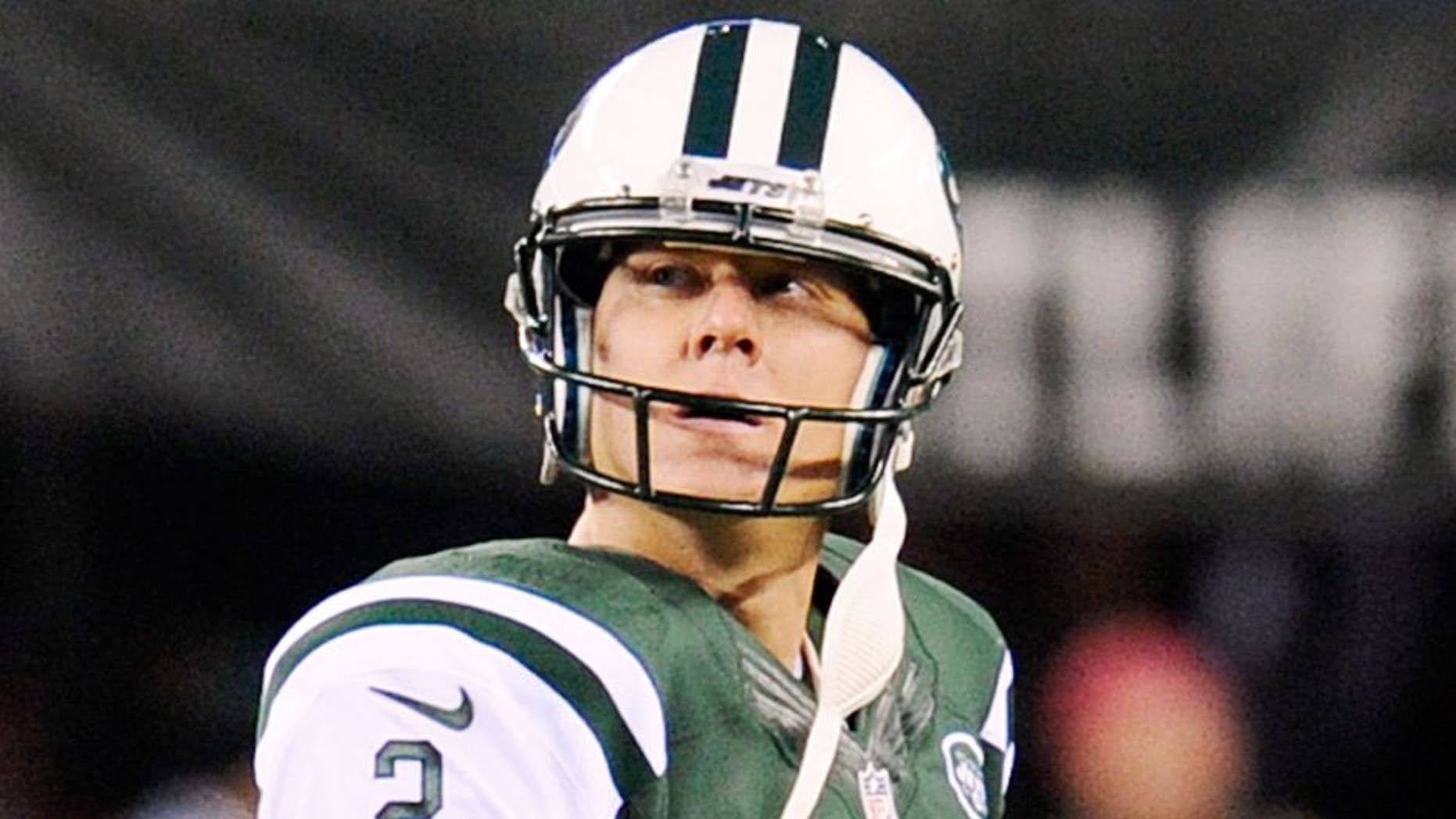 New York Jets kicker Nick Folk (2) reacts after missing a field goal against the Miami Dolphins during the second quarter of an NFL football game, Monday, Dec. 1, 2014, in East Rutherford, N.J. (AP Photo/Bill Kostroun)
