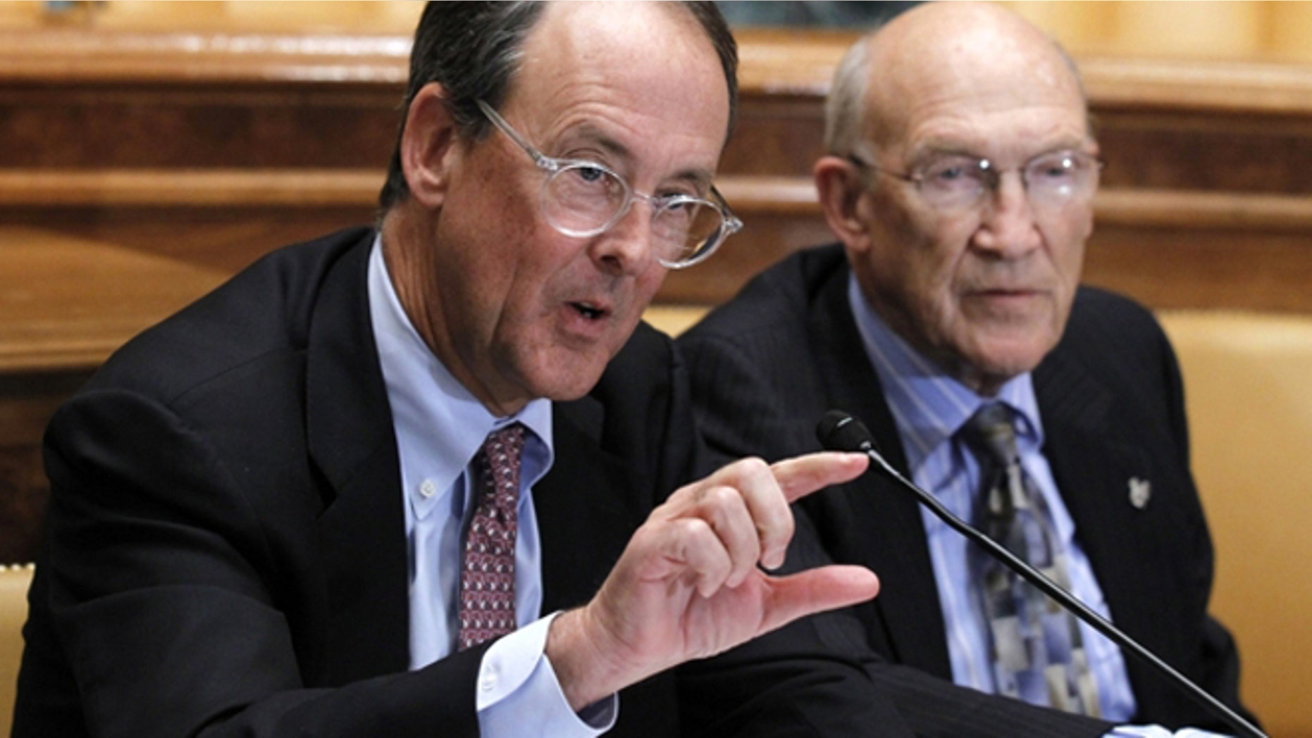 Nov. 10, 2010: Erskine Bowles, left, accompanied by former Wyoming Sen. Alan Simpson, co-chairmen of President Obama's bipartisan deficit commission, gestures while speaking on Capitol Hill in Washington.