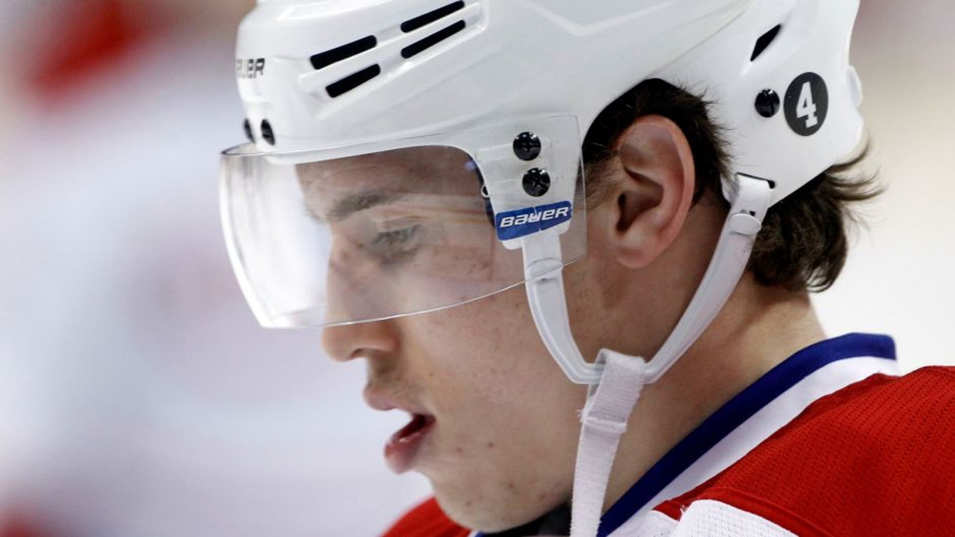 Montreal Canadiens right wing Brendan Gallagher wears a number 4 decal on his helmet in honor of hockey legend Jean Beliveau during warmups before an NHL hockey game against the Minnesota Wild in St. Paul, Minn., Wednesday, Dec. 3, 2014. (AP Photo/Ann Heisenfelt)