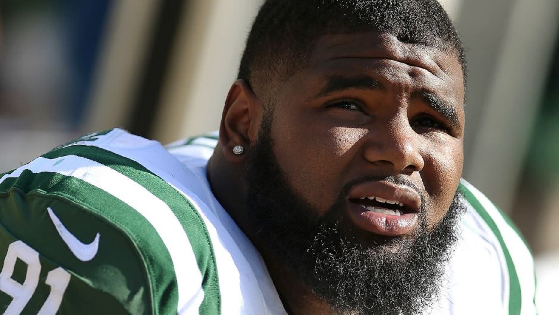 GREEN BAY, WI - SEPTEMBER 14: Defensive end Sheldon Richardson #91 of the New York Jets on the sidelines during the NFL game against the Green Bay Packers at Lambeau Field on September 14, 2014 in Green Bay, Wisconsin. The Packers defeated the Jets 31-24. (Photo by Christian Petersen/Getty Images) *** Local Caption *** Sheldon Richardson