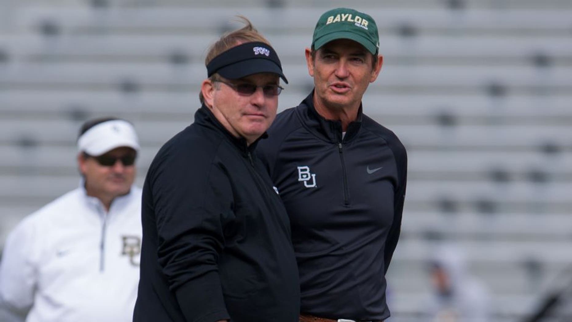 Nov 30, 2013; Fort Worth, TX, USA; TCU Horned Frogs head coach Gary Patterson and Baylor Bears head coach Art Briles before the game at Amon G. Carter Stadium. The Bears defeated the Horned Frogs 41-38. Mandatory Credit: Jerome Miron-USA TODAY Sports