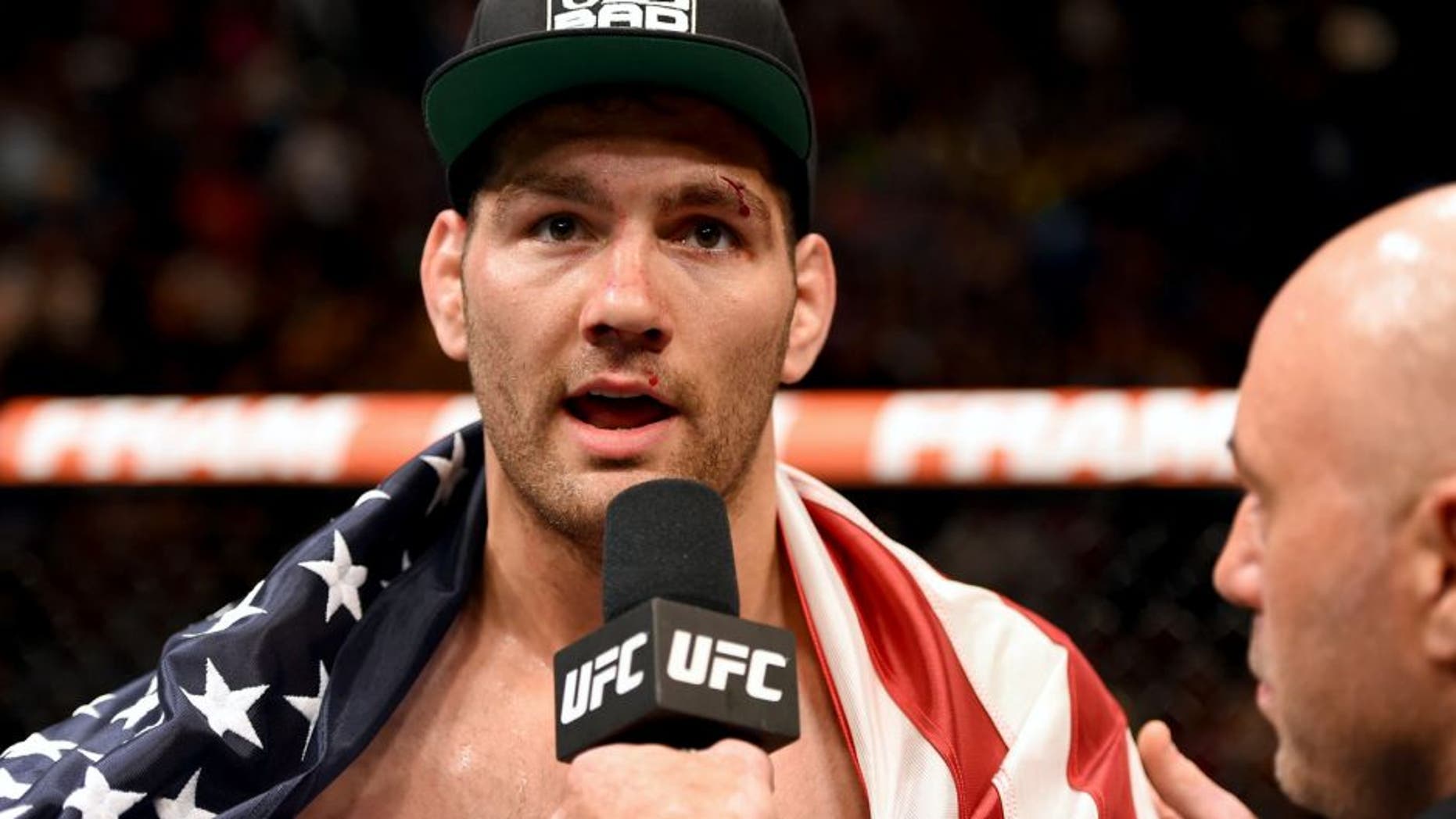 LAS VEGAS, NV - MAY 23: Chris Weidman speaks with Joe Rogan after his UFC middleweight championship bout during the UFC 187 event at the MGM Grand Garden Arena on May 23, 2015 in Las Vegas, Nevada. (Photo by Josh Hedges/Zuffa LLC/Zuffa LLC via Getty Images)
