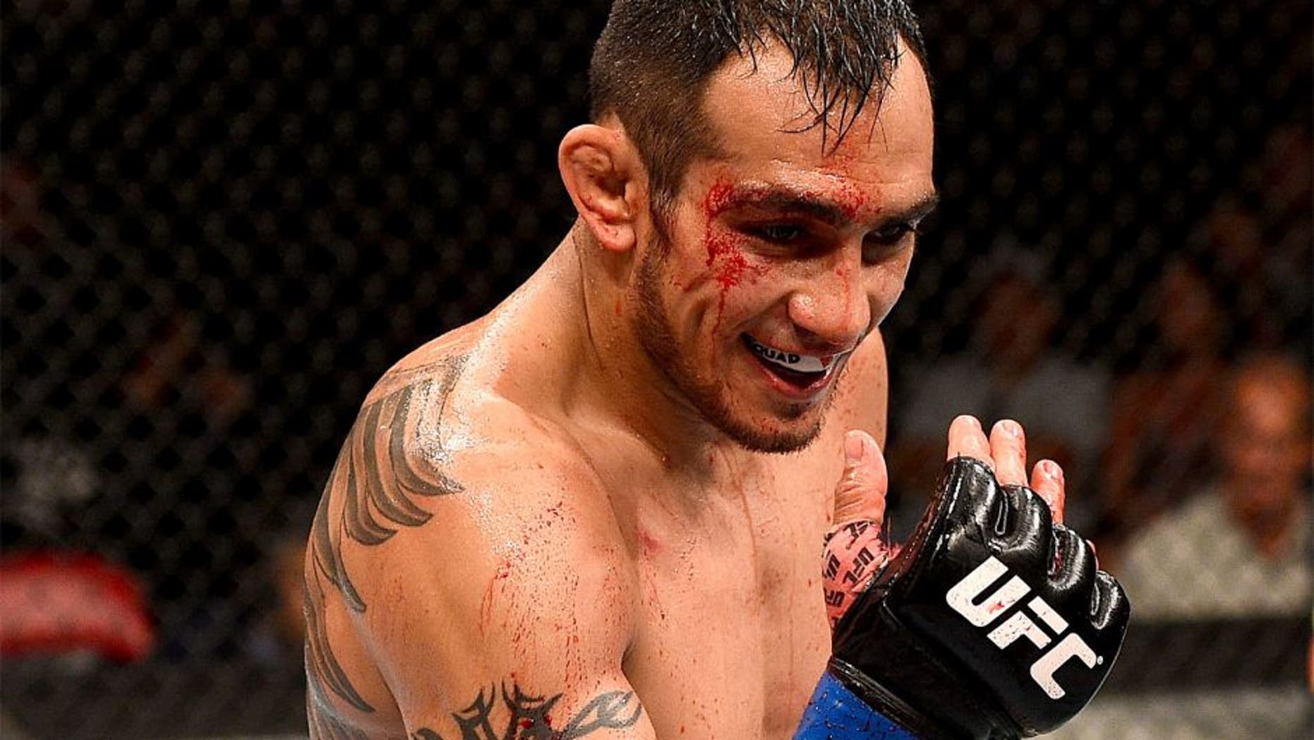 SAN DIEGO, CA - JULY 15: Tony Ferguson taunts Josh Thomson in their lightweight bout during the UFC event at the Valley View Casino Center on July 15, 2015 in San Diego, California. (Photo by Jeff Bottari/Zuffa LLC/Zuffa LLC via Getty Images)