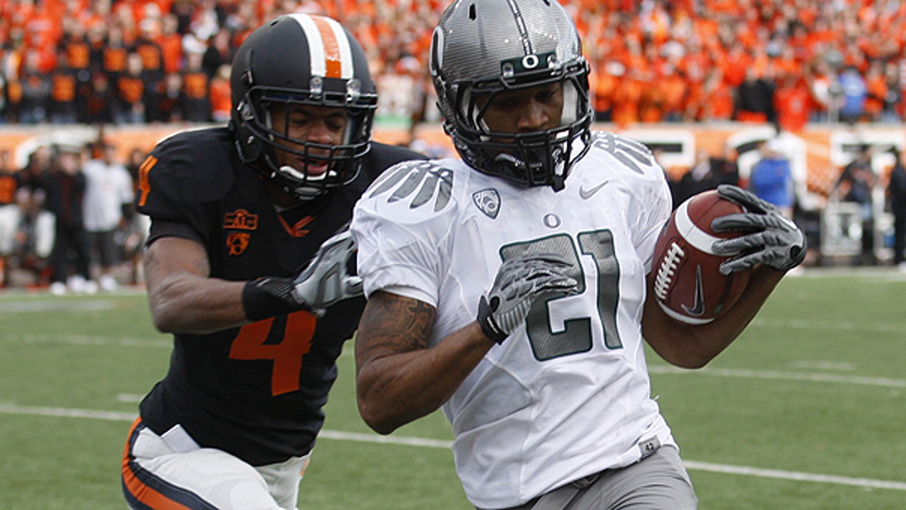Dec. 4: Oregon running back LaMichael James (21) runs the ball in for a score as Oregon State cornerback James Dockery (4) defends in the second quarter of an NCAA college football game in Corvallis, Ore.