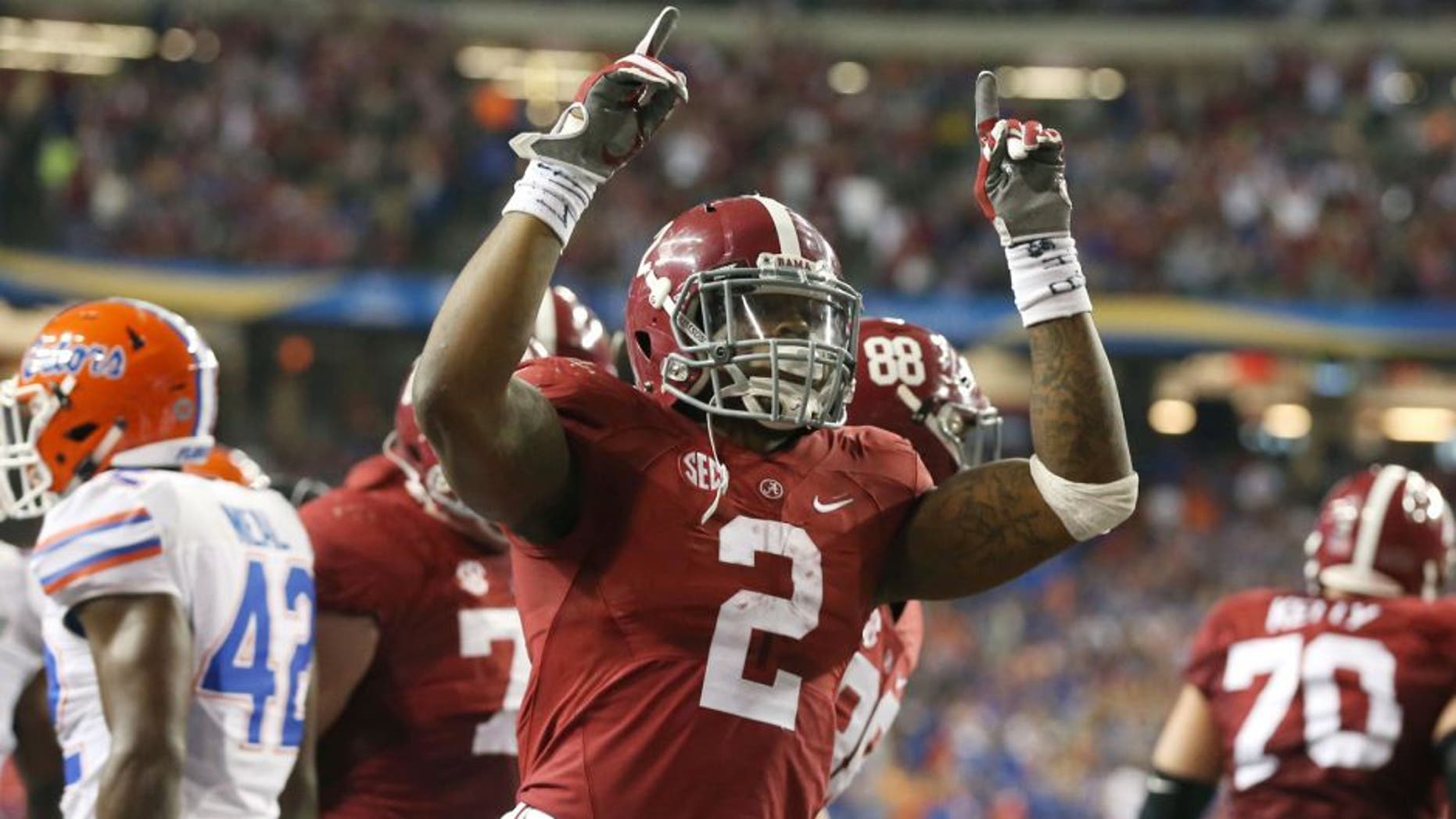 Dec 5, 2015; Atlanta, GA, USA; Alabama Crimson Tide running back Derrick Henry (2) celebrates his 2 yard touchdown run in the second quarter against the Florida Gators in the 2015 SEC Championship Game at the Georgia Dome. Mandatory Credit: Butch Dill-USA TODAY Sports