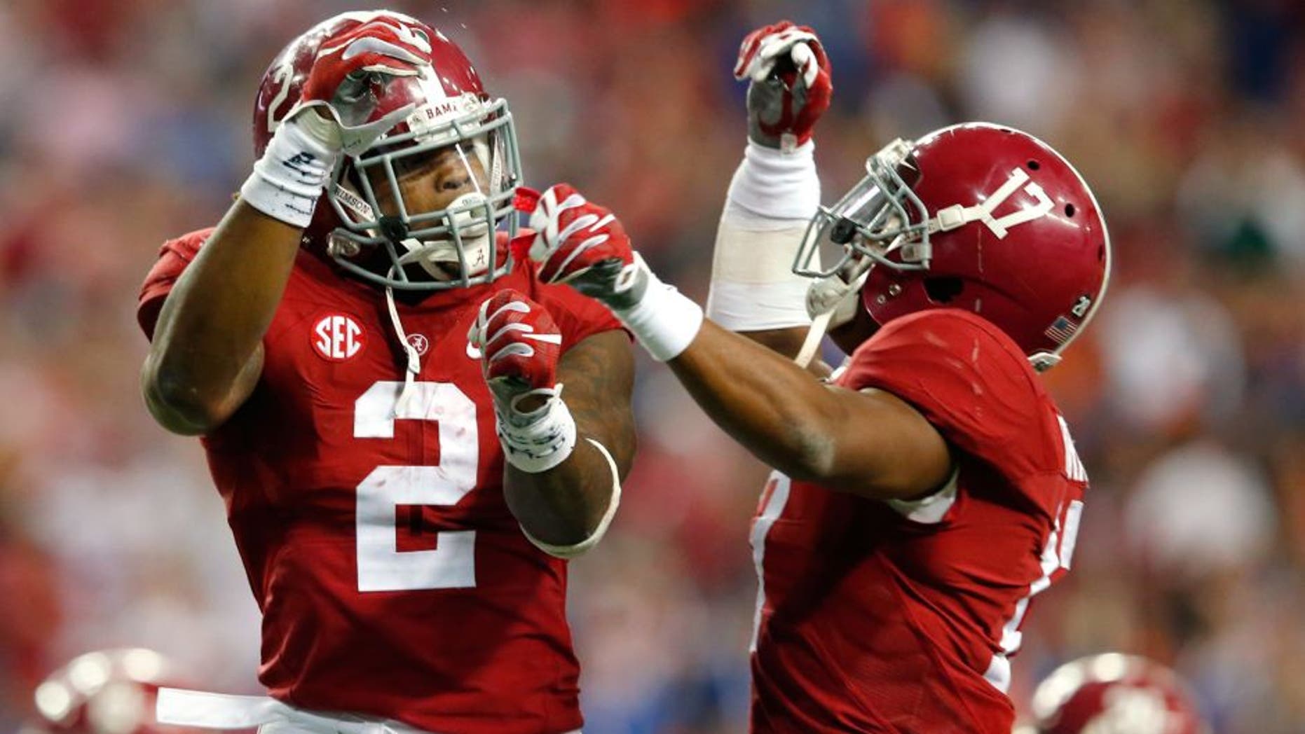 TLANTA, GA - DECEMBER 5: Running back Derrick Henry #2 of the Alabama Crimson Tide celebrates with running back Kenyan Drake #17 of the Alabama Crimson Tides after scoring a second quarter touchdown against the Florida Gators during the SEC Championship at the Georgia Dome on December 5, 2015 in Atlanta, Georgia. (Photo by Kevin C. Cox/Getty Images)