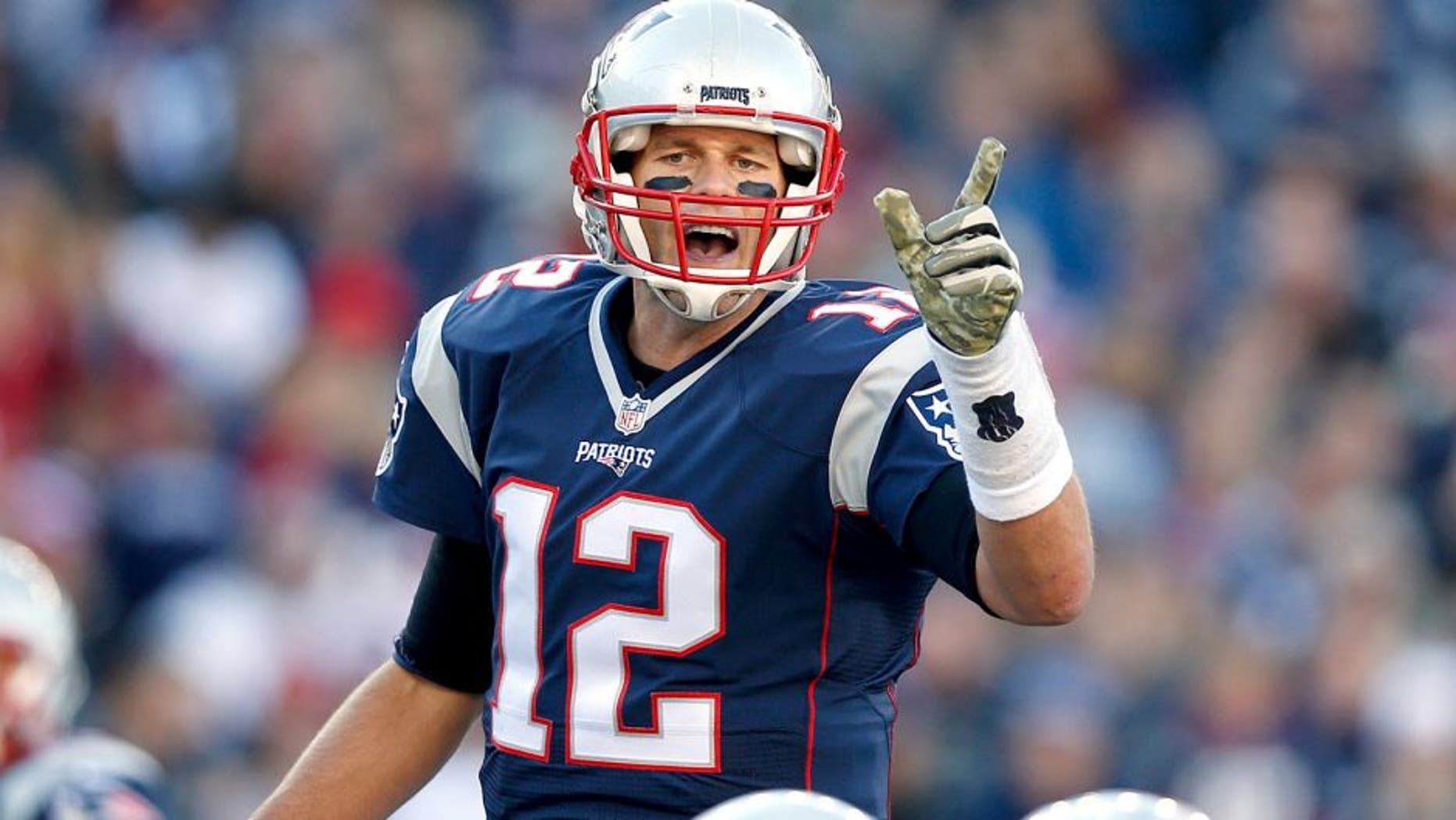 Nov 8, 2015; Foxborough, MA, USA; New England Patriots quarterback Tom Brady (12) makes an adjustment at the line of scrimmage during the second quarter against the Washington Redskins at Gillette Stadium. Mandatory Credit: Greg M. Cooper-USA TODAY Sports