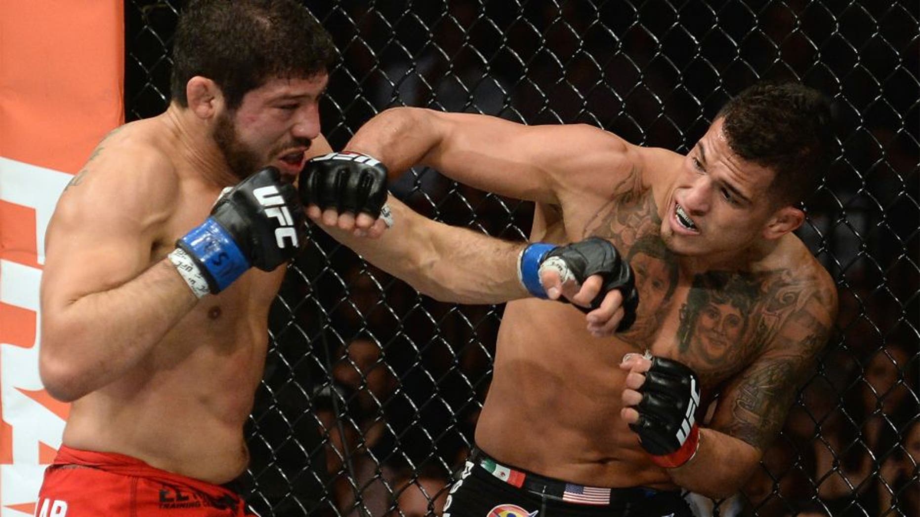 LAS VEGAS, NV - DECEMBER 06: (R-L) Anthony Pettis punches Gilbert Melendez in their UFC lightweight championship bout during the UFC 181 event inside the Mandalay Bay Events Center on December 6, 2014 in Las Vegas, Nevada. (Photo by Robert Laberge/Zuffa LLC/Zuffa LLC via Getty Images)