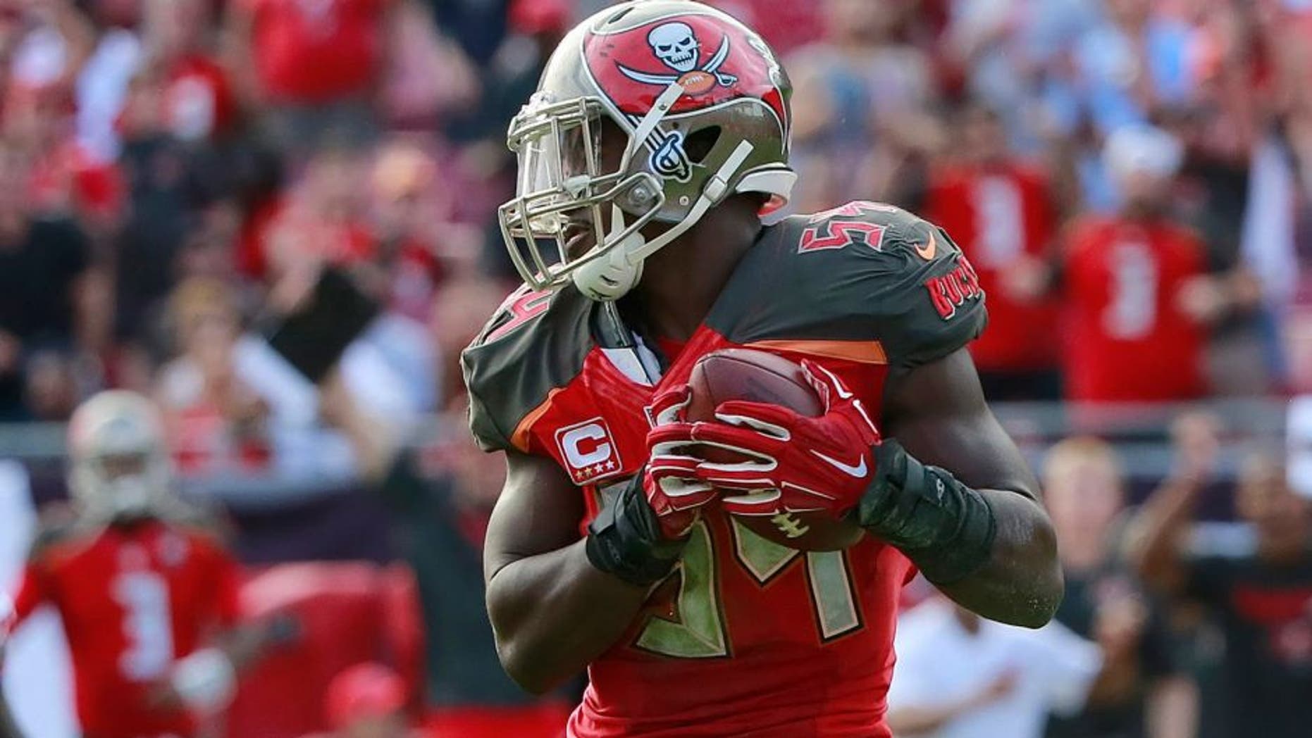 Dec 6, 2015; Tampa, FL, USA; Tampa Bay Buccaneers outside linebacker Lavonte David (54) intercepts the ball against the Atlanta Falcons during the second half at Raymond James Stadium. Tampa Bay defeated Atlanta 23-19. Mandatory Credit: Kim Klement-USA TODAY Sports