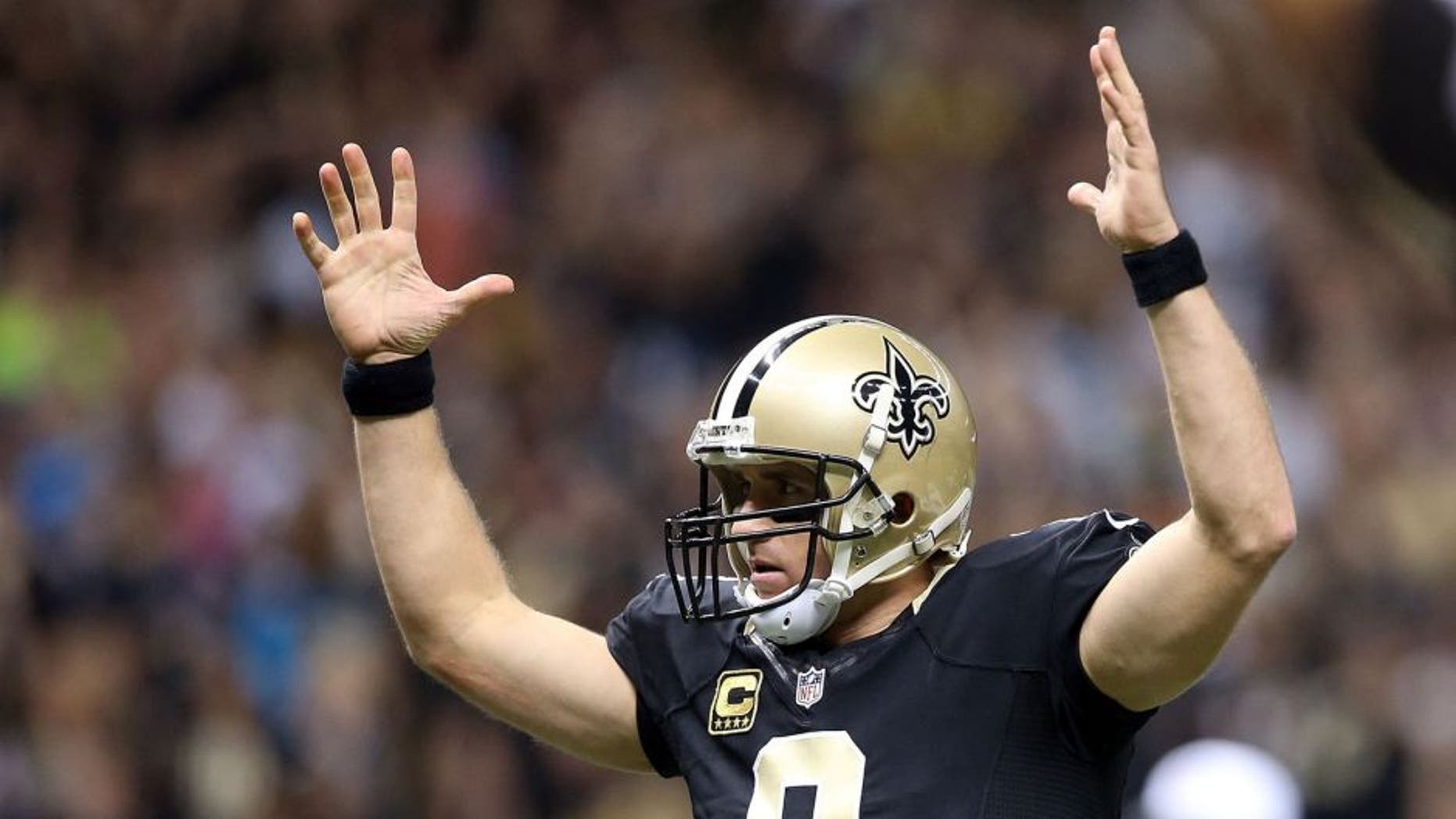 NEW ORLEANS, LA - DECEMBER 06: Drew Brees #9 of the New Orleans Saints celebrates after his team makes a 2 point conversion against the Carolina Panthers at Mercedes-Benz Superdome on December 6, 2015 in New Orleans, Louisiana. (Photo by Sean Gardner/Getty Images)