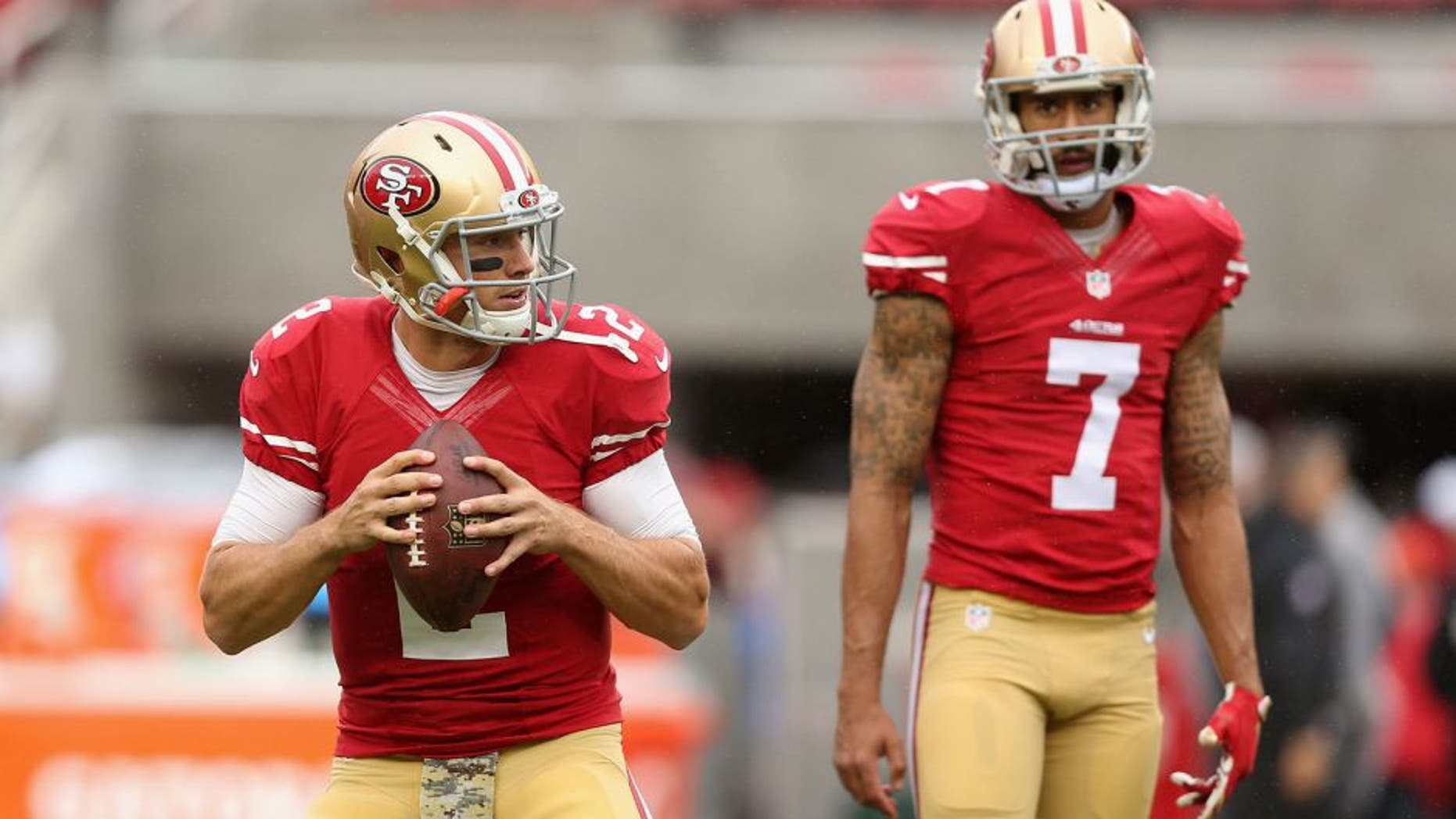 SANTA CLARA, CA - NOVEMBER 08: Colin Kaepernick #7 watches Blaine Gabbert #2 of the San Francisco 49ers warm up before their game against the Atlanta Falcons at Levi's Stadium on November 8, 2015 in Santa Clara, California. (Photo by Ezra Shaw/Getty Images)