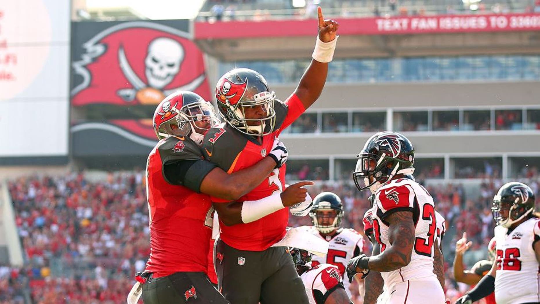 TAMPA, FL - DECEMBER 06: Jameis Winston #3 of the Tampa Bay Buccaneers reacts after scoring a touchdown during the first quarter of the game against the Atlanta Falcons at Raymond James Stadium on December 6, 2015 in Tampa, Florida. (Photo by Rob Foldy/Getty Images)
