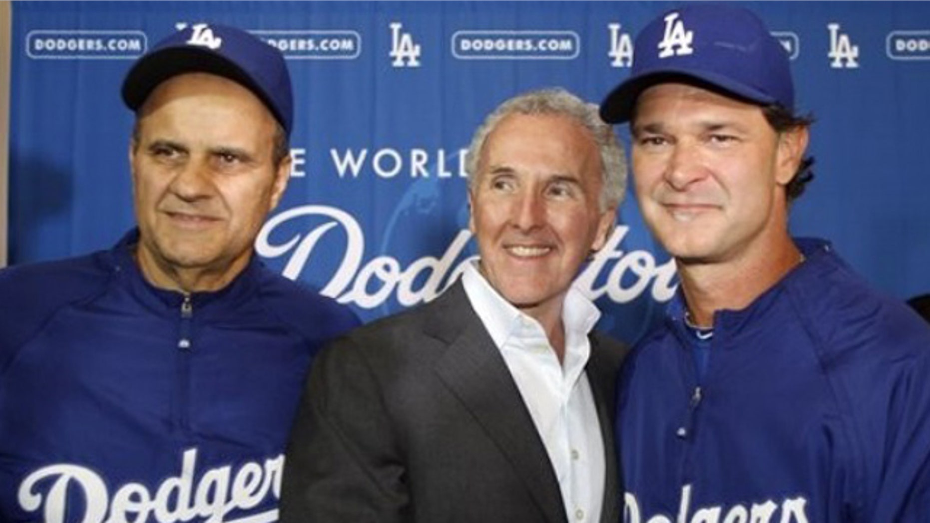 Sept. 17: Los Angeles Dodgers owner Frank McCourt, center, shakes hands with hitting coach Don Mattingly, right, after a news conference to name Mattingly the Dodgers manager for the 2011 season and that Joe Torre, left, will step aside from the position in Los Angeles.