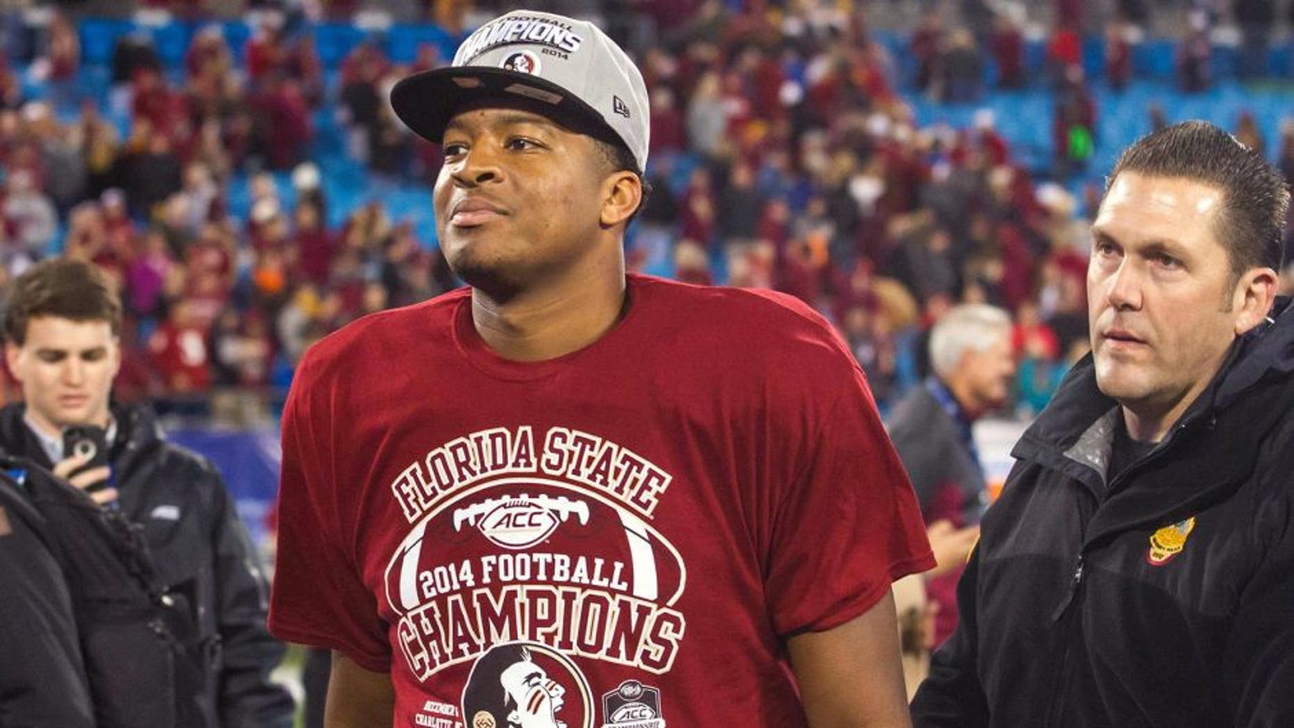 Dec 6, 2014; Charlotte, NC, USA; Florida State Seminoles quarterback Jameis Winston (5) walks off the field after defeating the Georgia Tech Yellow Jackets at Bank of America Stadium. FSU defeated Georgia Tech 37-35. Mandatory Credit: Jeremy Brevard-USA TODAY Sports
