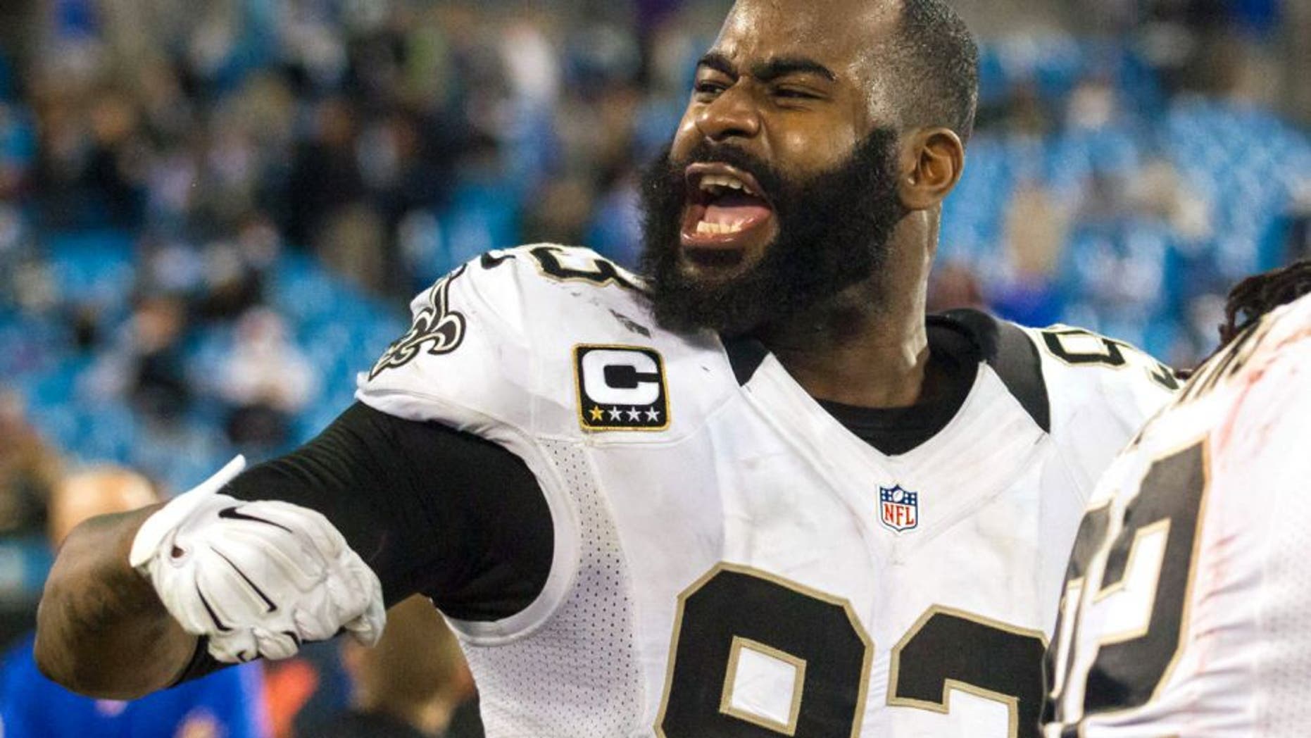 Oct 30, 2014; Charlotte, NC, USA; New Orleans Saints outside linebacker Junior Galette (93) yells out to the fans in the final minutes of the game against the Carolina Panthers at Bank of America Stadium. The Saints defeated the Panthers 28-10. Mandatory Credit: Jeremy Brevard-USA TODAY Sports