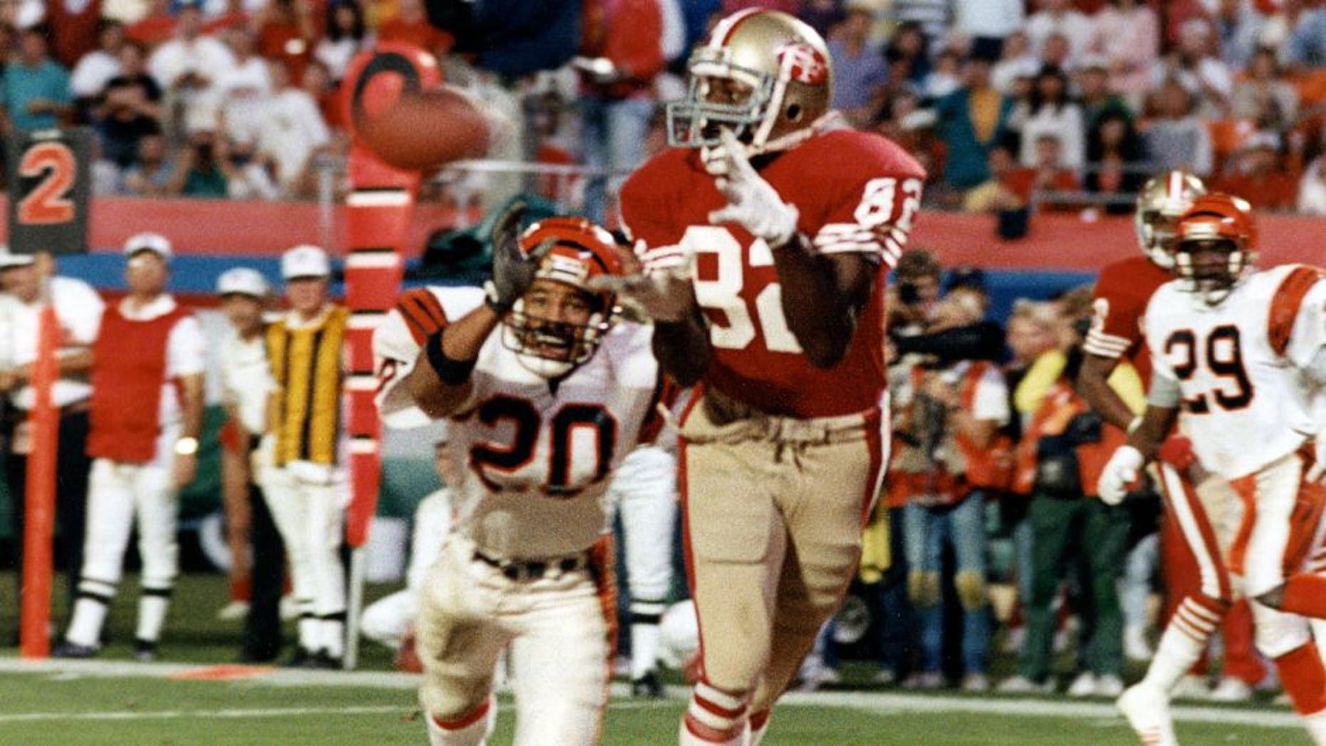 MIAMI, FL - JANUARY 22: Wide receiver John Taylor #82 of the San Francisco 49ers catches the game-winning 10-yard touchdown reception in the final moments of the 49ers 20-16 victory over the Cincinnati Bengals in Super Bowl XXIII on January 22, 1989 at Joe Robbie Stadium in Miami, Florida. (Photo by Robert Riger/Getty Images)