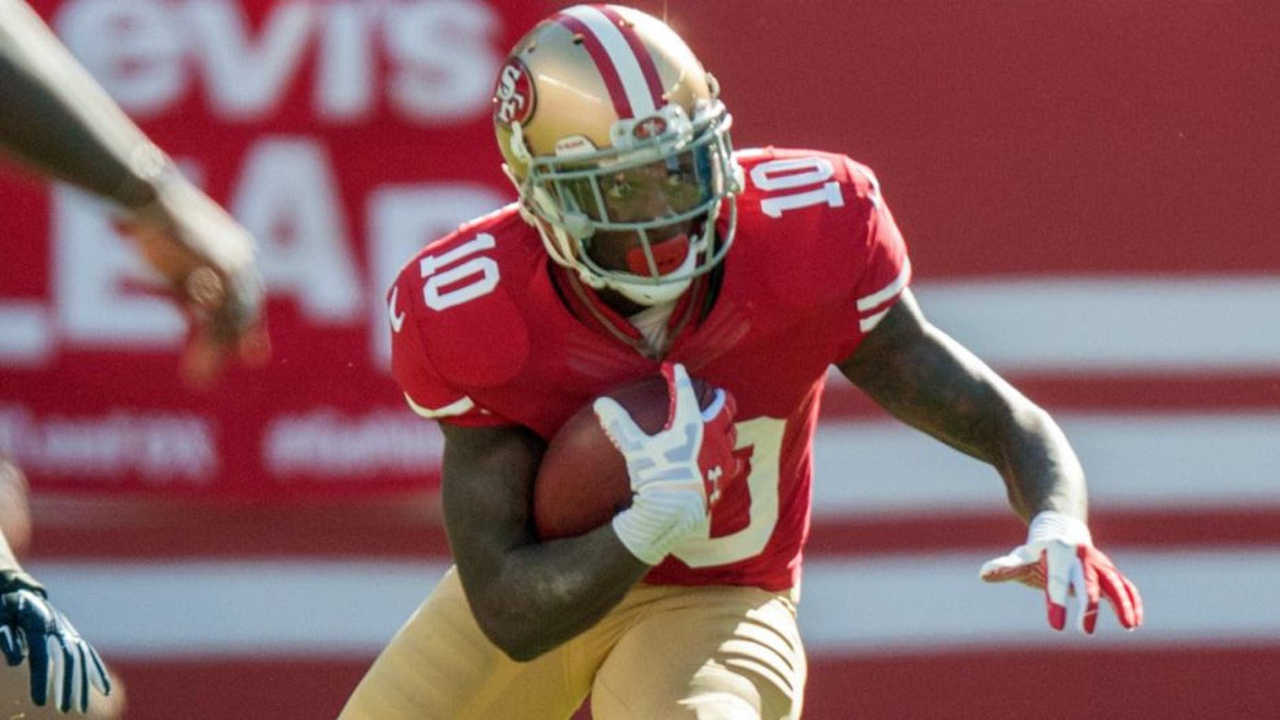 Nov 2, 2014; Santa Clara, CA, USA; San Francisco 49ers wide receiver Bruce Ellington (10) returns a punt for a gain against the St. Louis Rams during the first quarter at Levi's Stadium. Mandatory Credit: Ed Szczepanski-USA TODAY Sports