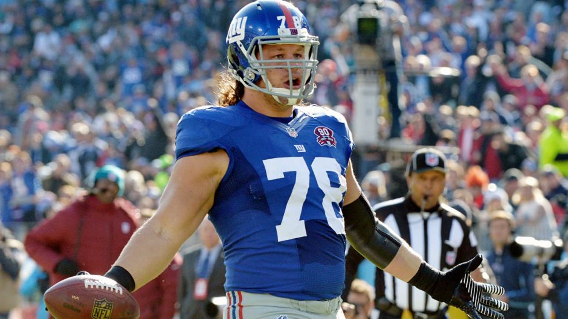 Dec 7, 2014; Nashville, TN, USA; New York Giants defensive tackle Markus Kuhn (78) scores a touchdown against the Tennessee Titans during the first half at LP Field. Mandatory Credit: Don McPeak-USA TODAY Sports