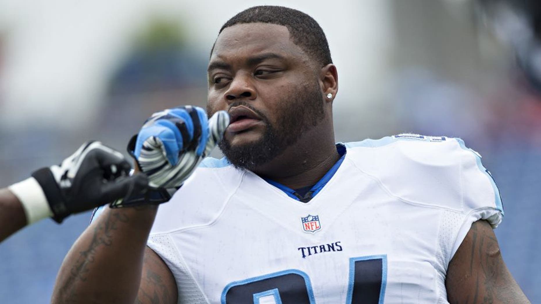NASHVILLE, TN - OCTOBER 12: Sammie Hill #94 of the Tennessee Titans warming up before a game against the Jacksonville Jaguars at LP Field on October 12, 2014 in Nashville, Tennessee. The Titans defeated the Jaguars 16-14. (Photo by Wesley Hitt/Getty Images)