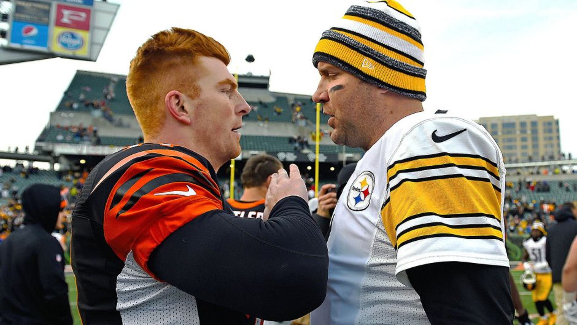 Dec 7, 2014; Cincinnati, OH, USA; Pittsburgh Steelers quarterback Ben Roethlisberger (7) and Cincinnati Bengals quarterback Andy Dalton (14) after the game at Paul Brown Stadium. Pittsburgh Steelers defeat the Cincinnati Bengals 42-21. Mandatory Credit: Mike DiNovo-USA TODAY Sports