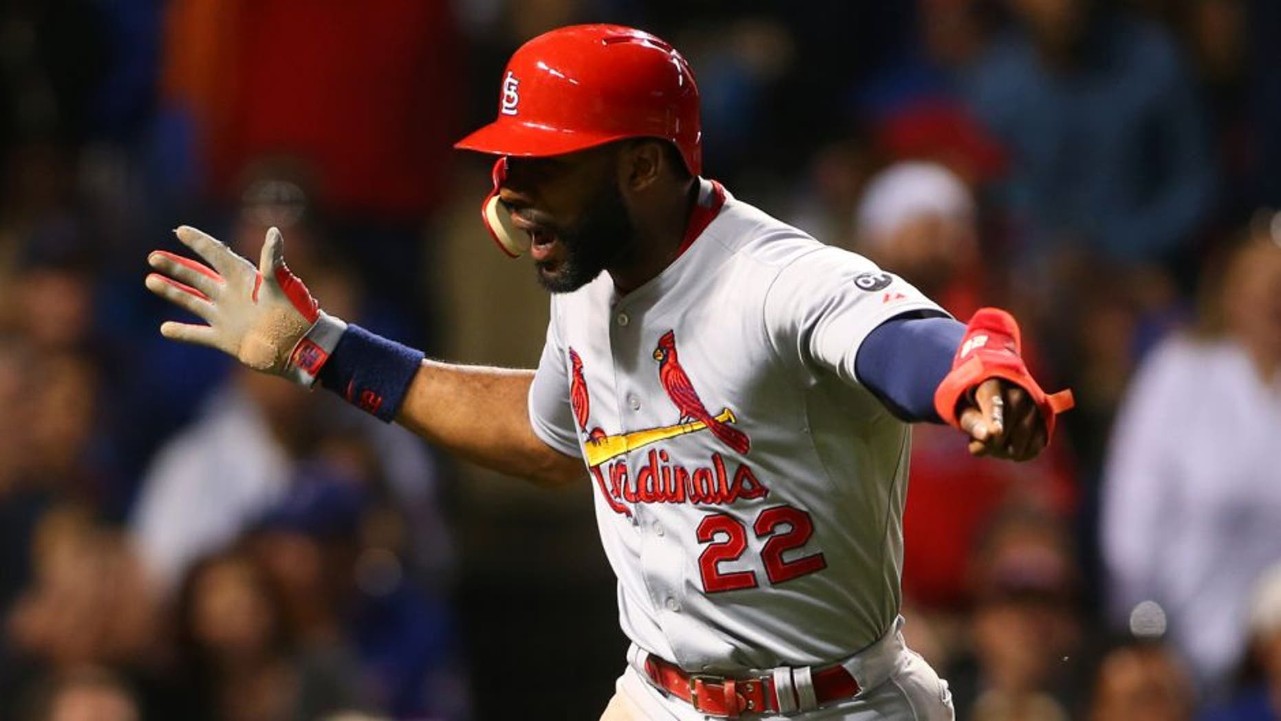 Jul 7, 2015; Chicago, IL, USA; St. Louis Cardinals right fielder Jason Heyward (22) celebrates after scoring during the sixth inning in game two of a baseball doubleheader against the Chicago Cubs at Wrigley Field. Mandatory Credit: Caylor Arnold-USA TODAY Sports