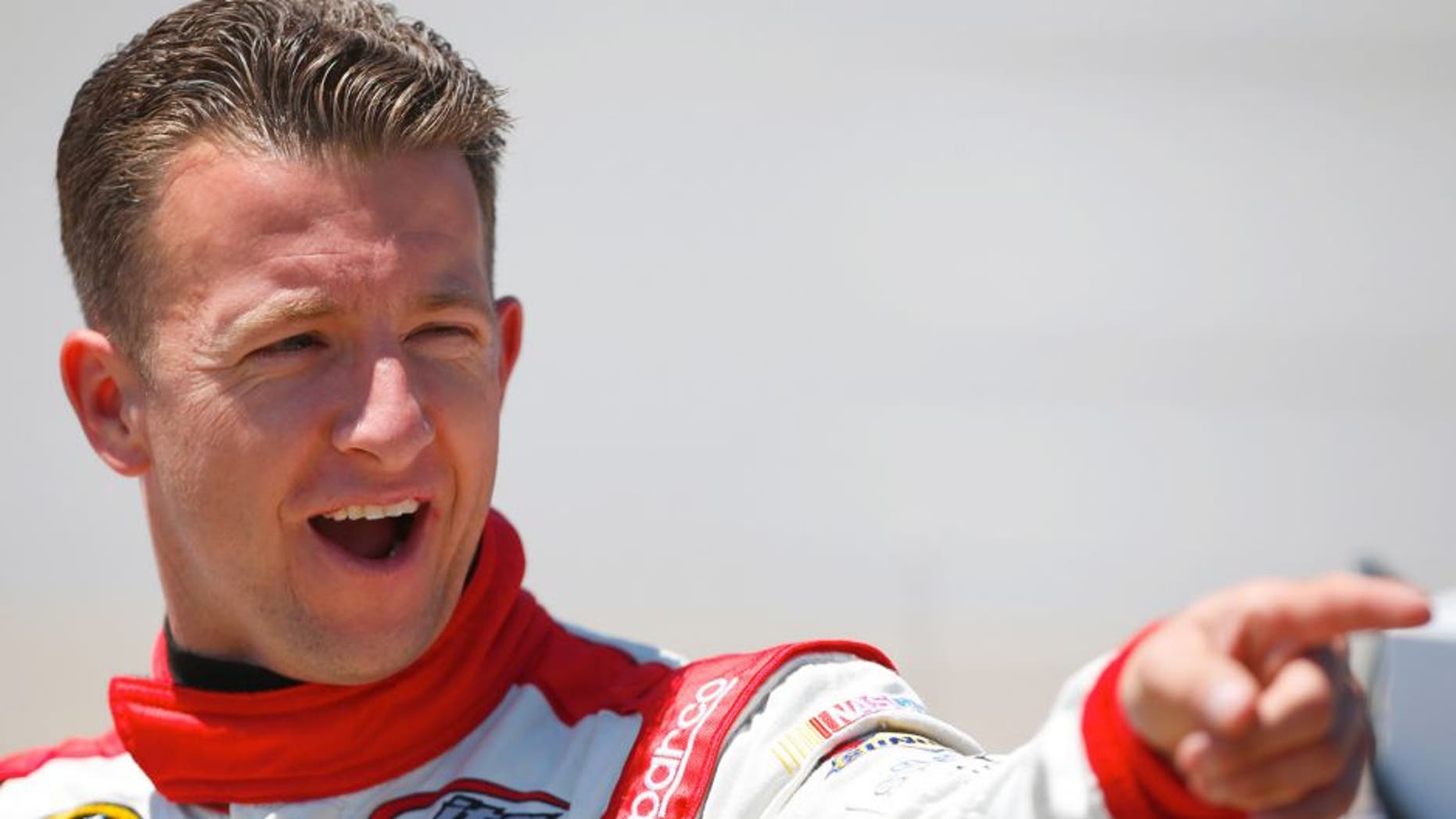 AJ Allmendinger, driver of the #47 Kroger/Hungry Jack Chevrolet, stands on the grid during qualifying for the NASCAR Sprint Cup Series GEICO 500 at Talladega Superspeedway on May 2, 2015 in Talladega, Alabama. (Photo by Matt Sullivan/Getty Images)
