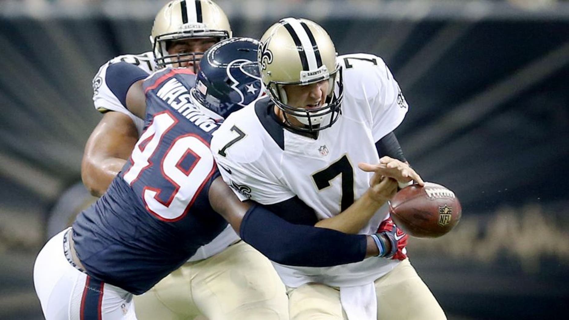 Aug 30, 2015; New Orleans, LA, USA; Houston Texans outside linebacker Tony Washington (49) knocks the football away from New Orleans Saints quarterback Luke McCown (7) in the second quarter of their game at the Mercedes-Benz Superdome. Mandatory Credit: Chuck Cook-USA TODAY Sports