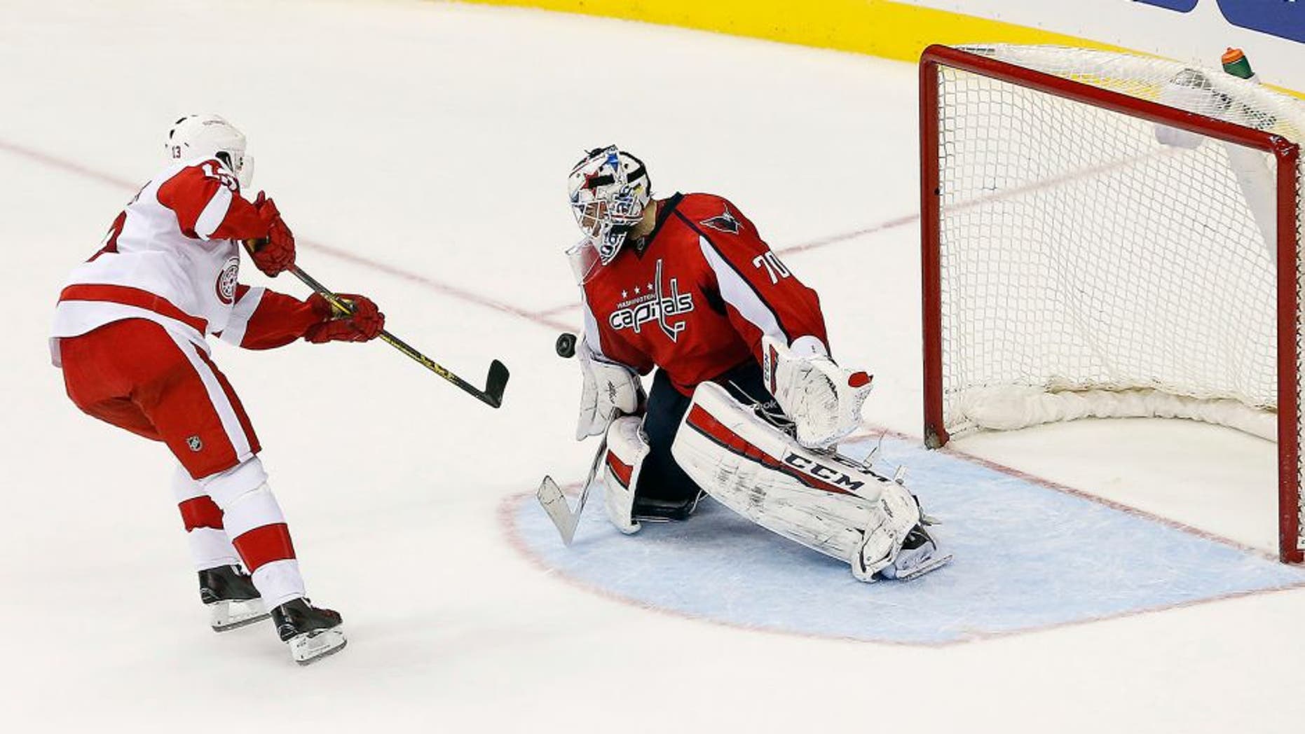 Dec 8, 2015; Washington, DC, USA; Washington Capitals goalie Braden Holtby (70) makes the game clinching save against Detroit Red Wings center Pavel Datsyuk (13) in a shootout at Verizon Center. The Capitals won 3-2 in a shootout. Mandatory Credit: Geoff Burke-USA TODAY Sports