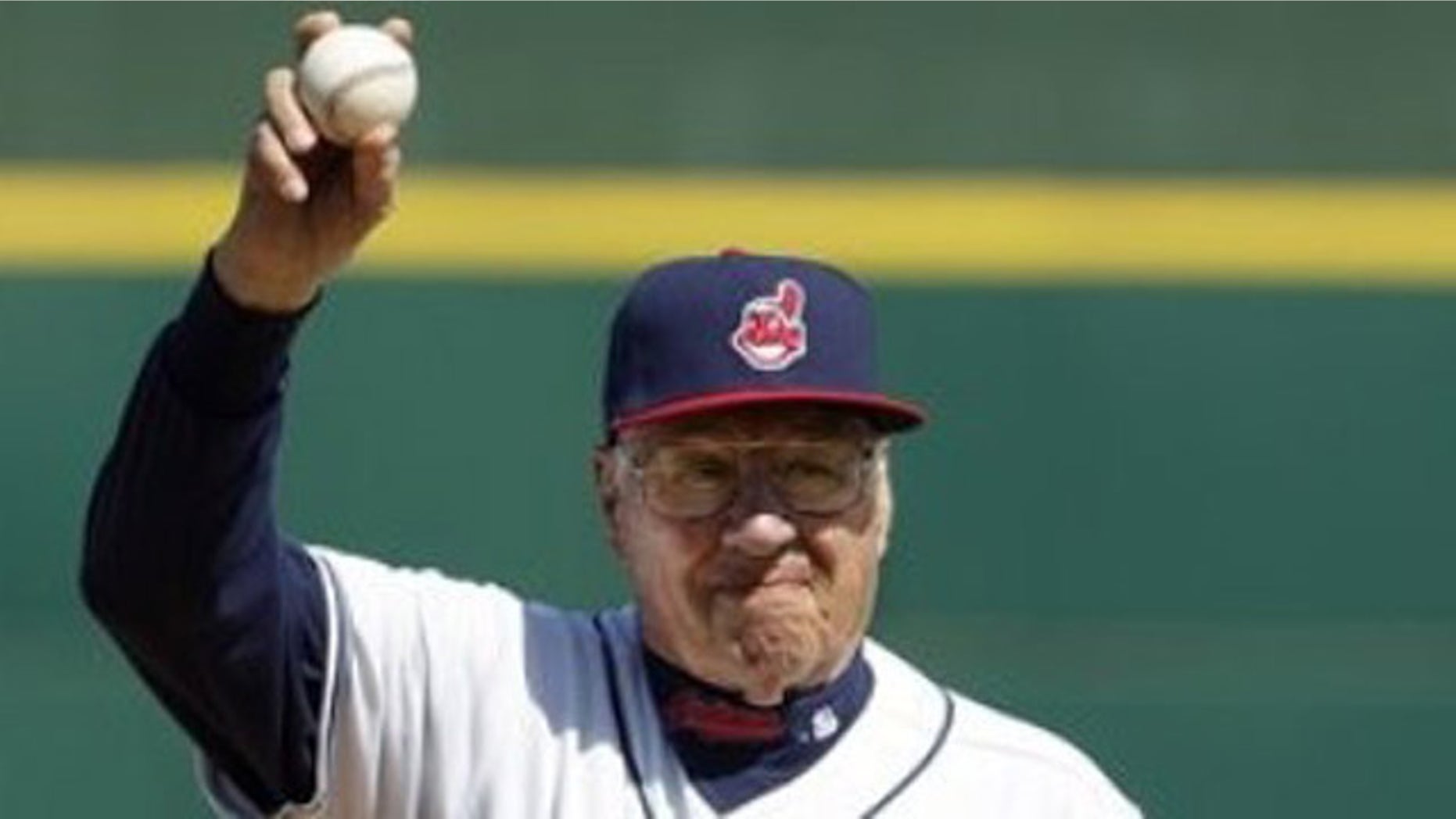 March 6: Hall of Fame pitcher Bob Feller waves to the fans before throwing out a ceremonial first pitch before a spring training baseball game between the Cincinnati Reds and Cleveland Indians in Goodyear, Ariz.