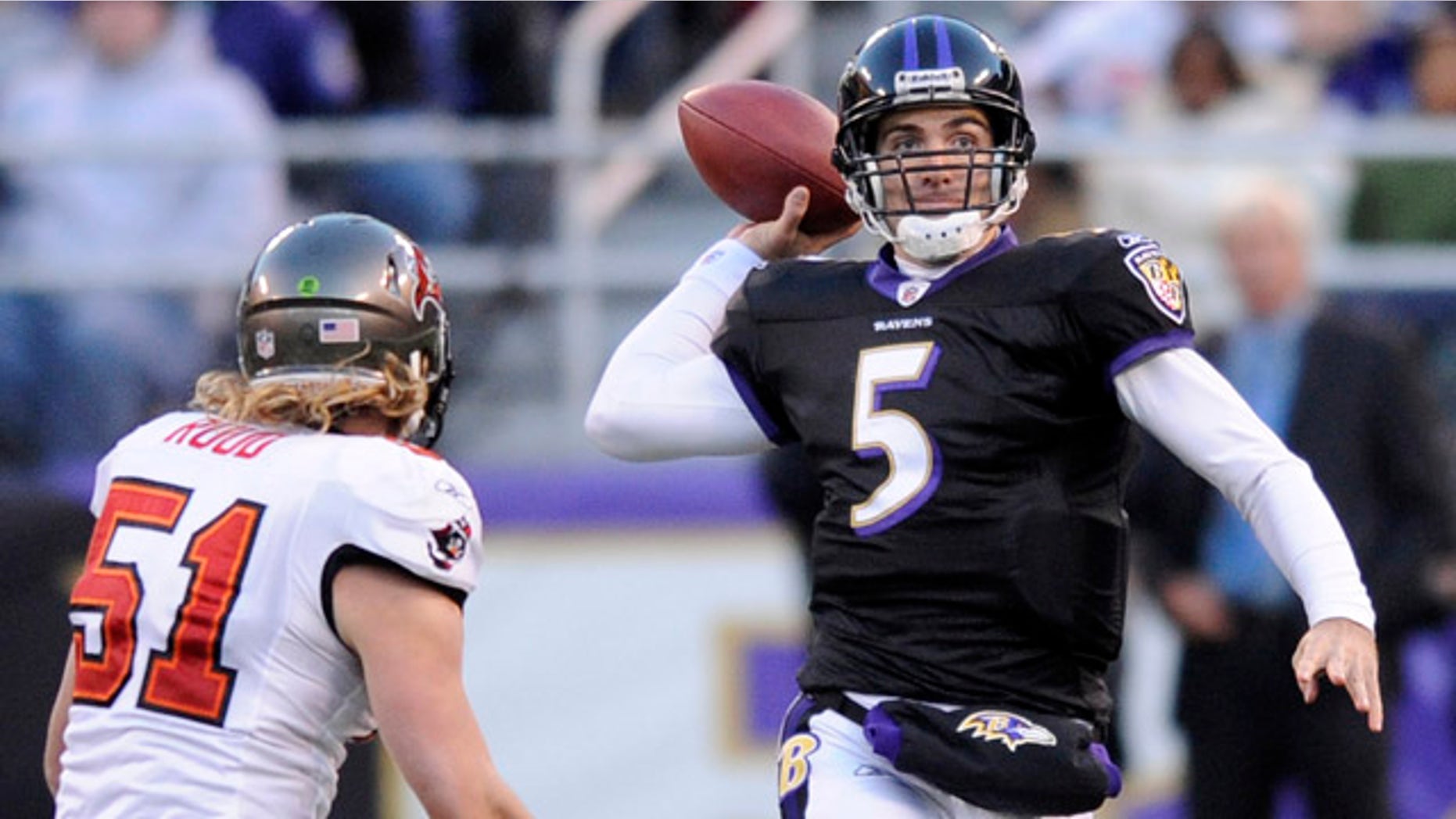Nov. 28: Baltimore Ravens quarterback Joe Flacco (5) throws a pass while being pressured byTampa Bay Buccaneers linebacker Barrett Ruud (51) during the first half of an NFL football game in Baltimore.