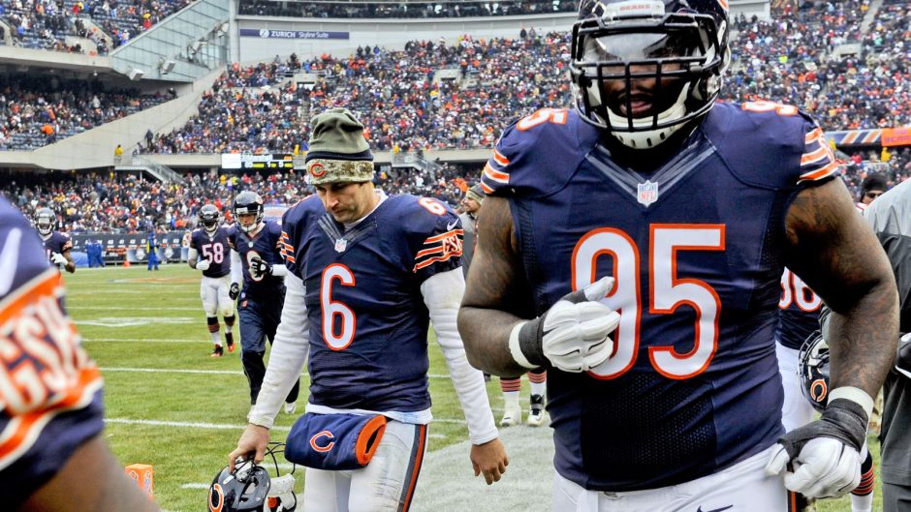 Nov 16, 2014; Chicago, IL, USA; Chicago Bears quarterback Jay Cutler (6) and Chicago Bears defensive tackle Ego Ferguson (95) at half-time during their game against the Minnesota Vikings at Soldier Field. The Bears won 21-13. Mandatory Credit: Matt Marton-USA TODAY Sports